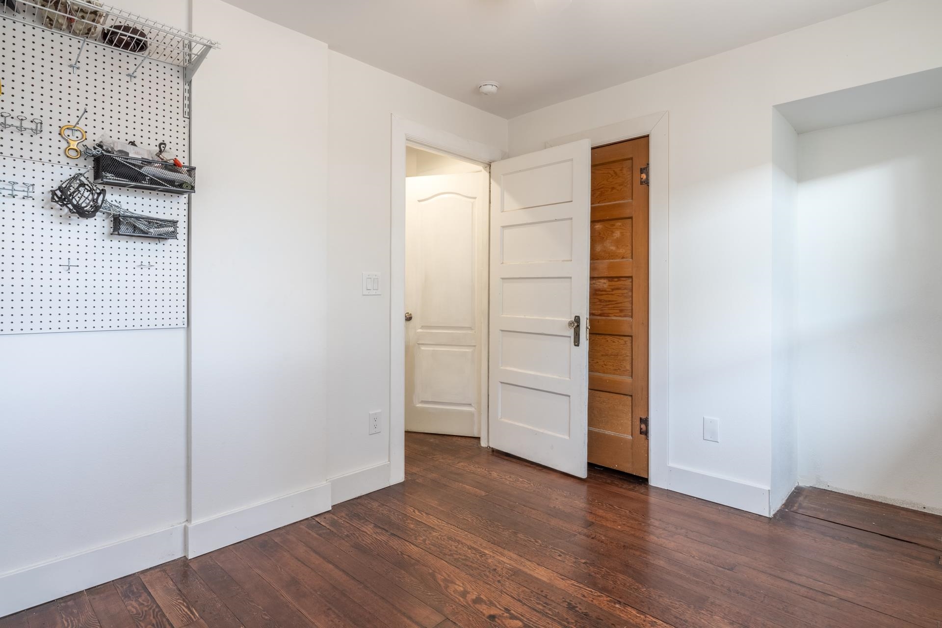91 3rd Street Lee Vining, CA 93541 - Photo 21 of 44 an empty room with wooden floor and closet