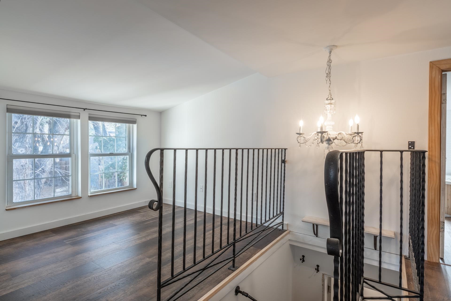 91 3rd Street Lee Vining, CA 93541 - Photo 23 of 44 a view of a hallway with windows and chandelier
