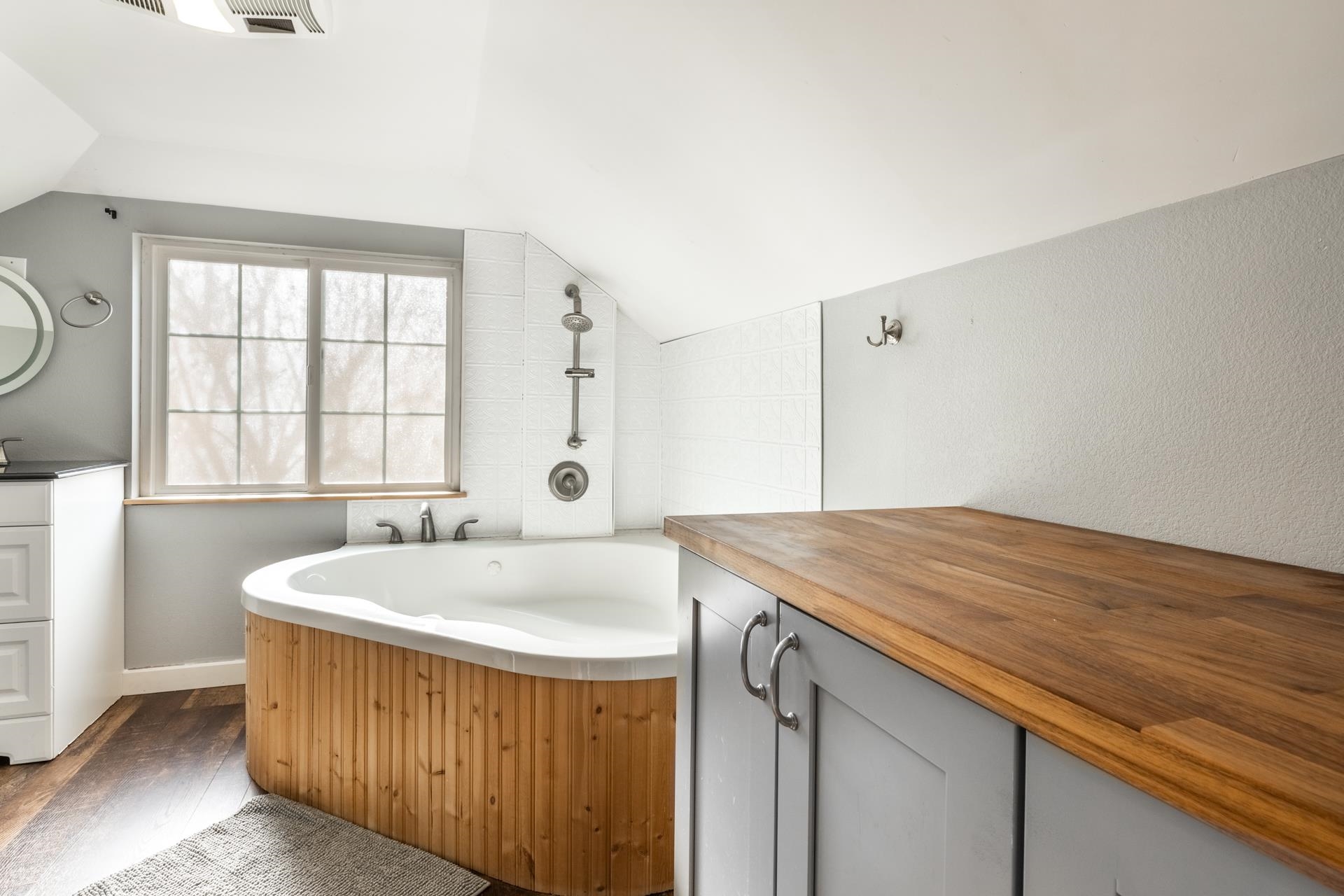 91 3rd Street Lee Vining, CA 93541 - Photo 30 of 44 a spacious bathroom with a granite countertop sink and a bathtub