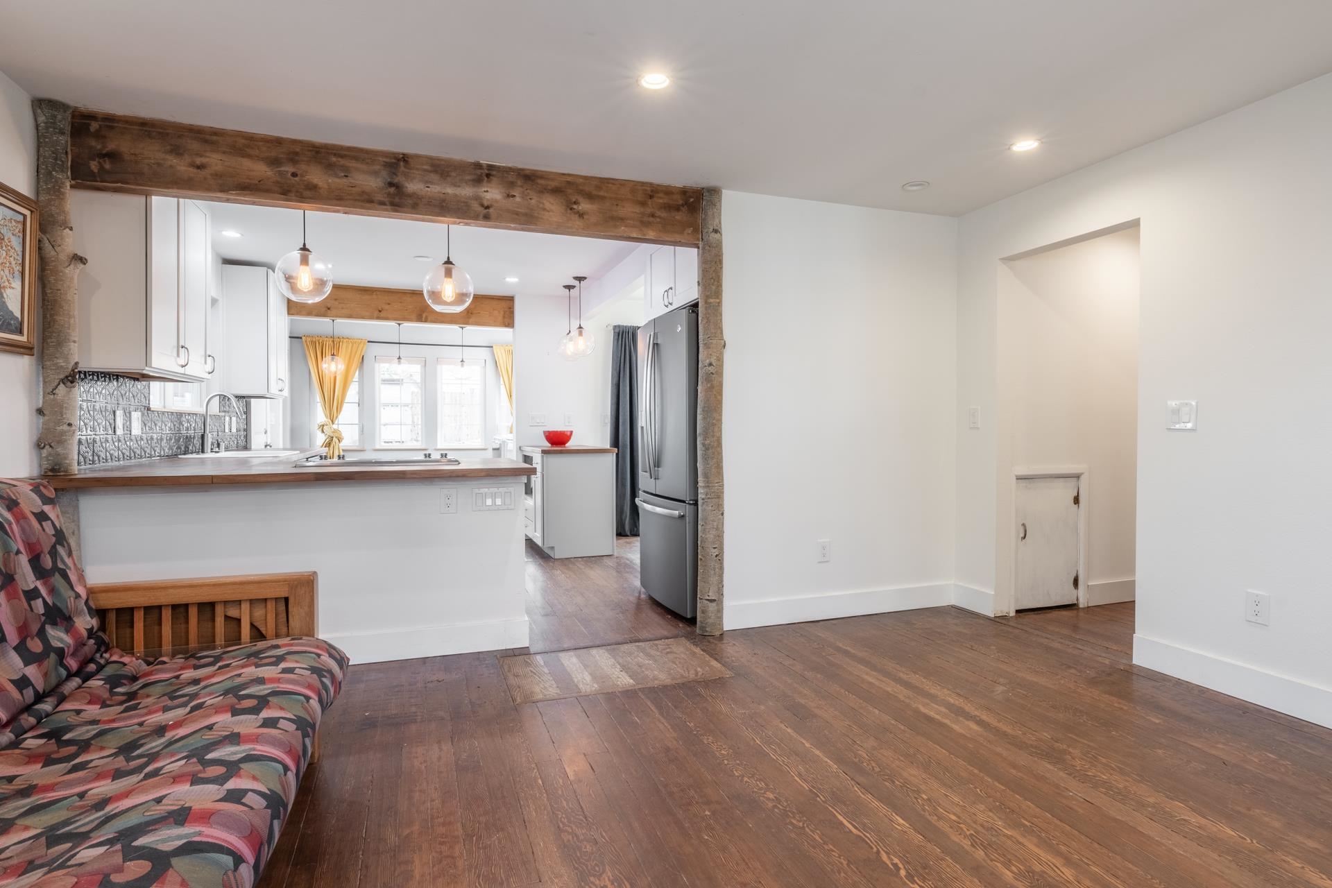 91 3rd Street Lee Vining, CA 93541 - Photo 3 of 44 a kitchen with stainless steel appliances a refrigerator and wooden floor