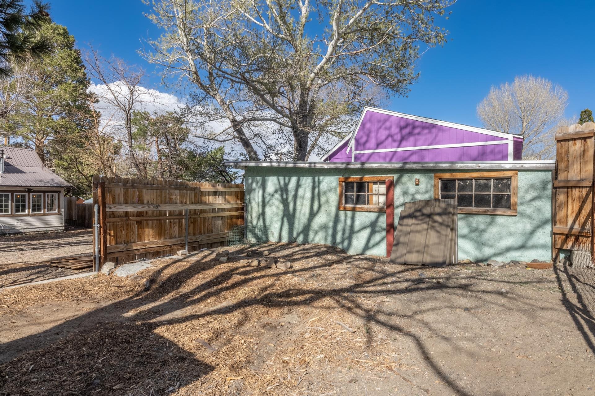 91 3rd Street Lee Vining, CA 93541 - Photo 37 of 44 a view of a backyard with a table and chairs under an umbrella