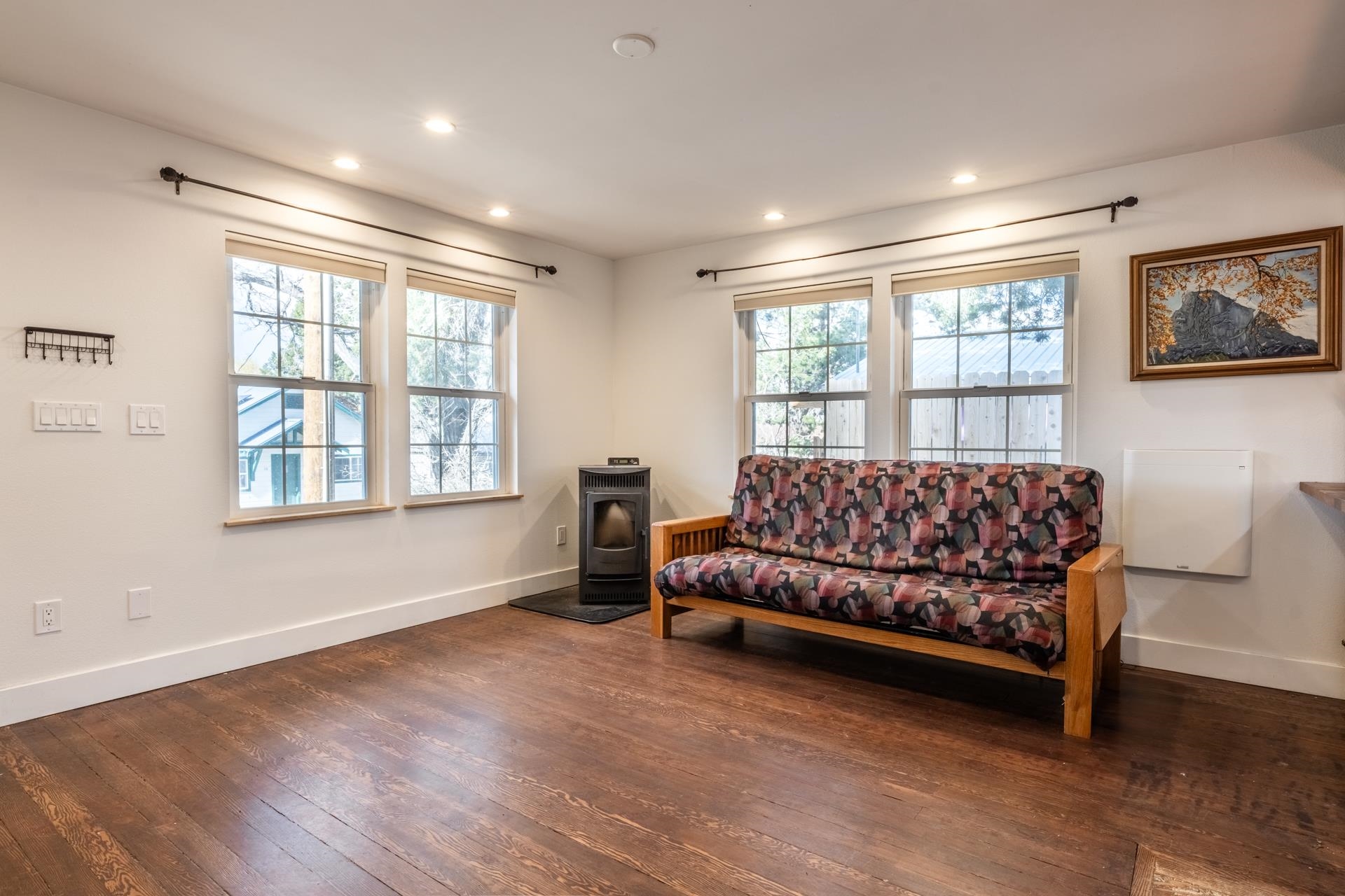 91 3rd Street Lee Vining, CA 93541 - Photo 5 of 44 a large bedroom with a bed and wooden floor