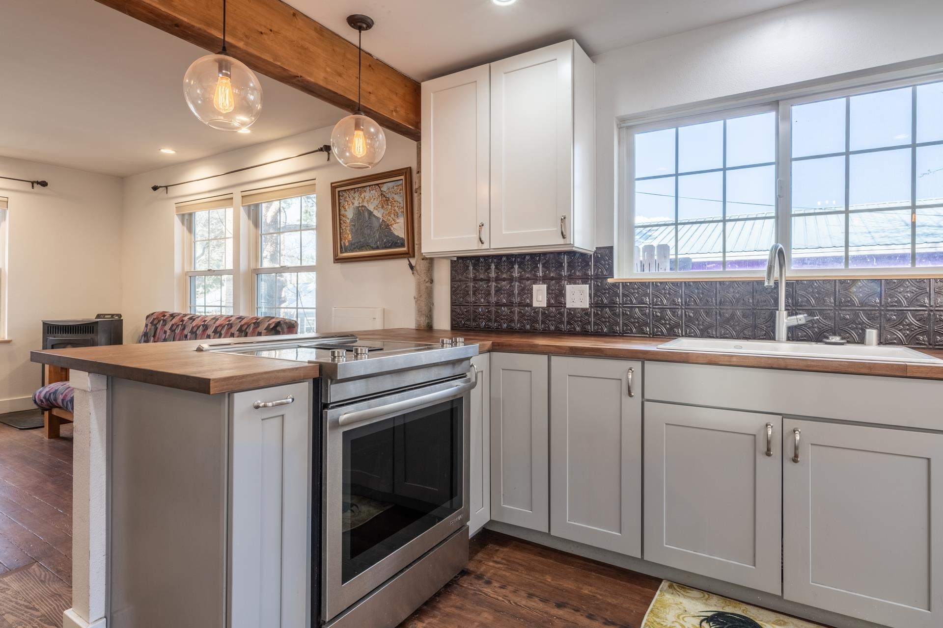 91 3rd Street Lee Vining, CA 93541 - Photo 7 of 44 a kitchen with stainless steel appliances granite countertop a sink and a stove