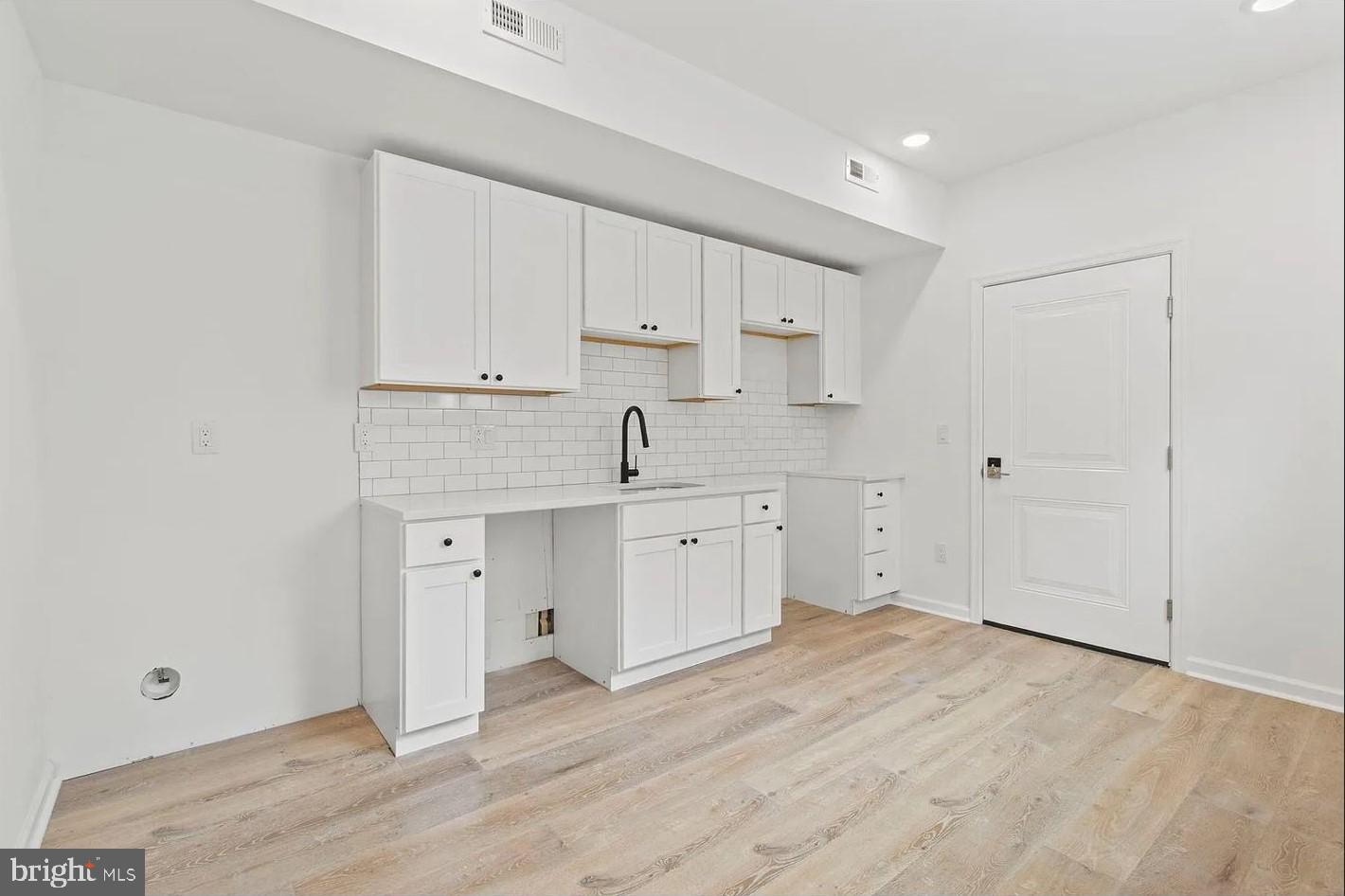 5225 Walnut Street, Unit 4 Philadelphia, PA 19139 - Photo 1 of 11 a view of kitchen with wooden floor