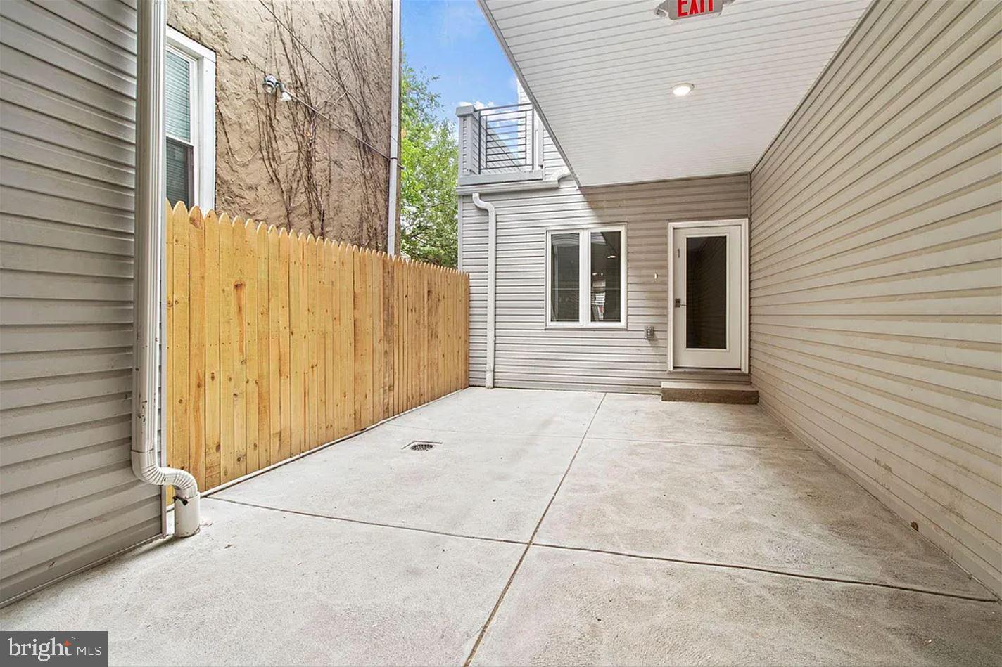 5225 Walnut Street, Unit 4 Philadelphia, PA 19139 - Photo 8 of 11 a view of a house with a backyard