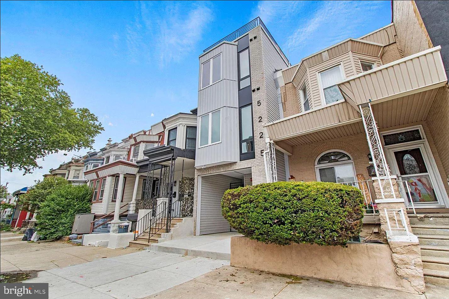 5225 Walnut Street, Unit 4 Philadelphia, PA 19139 - Photo 10 of 11 front view of a house with a yard