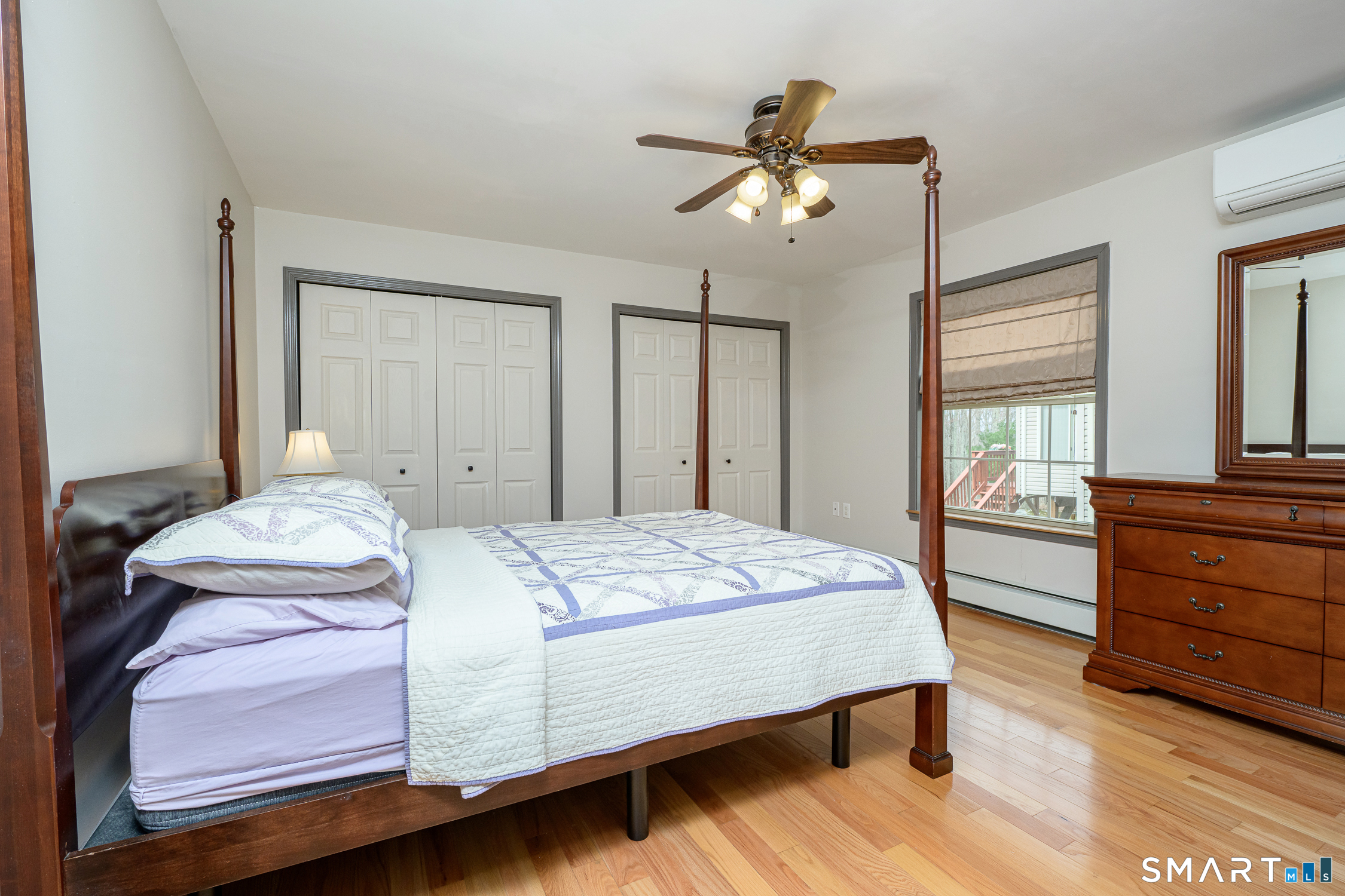 3 Oriole Drive, Unit 3 Killingly, CT 06239 - Photo 14 of 29 a bedroom with a bed and wooden floor