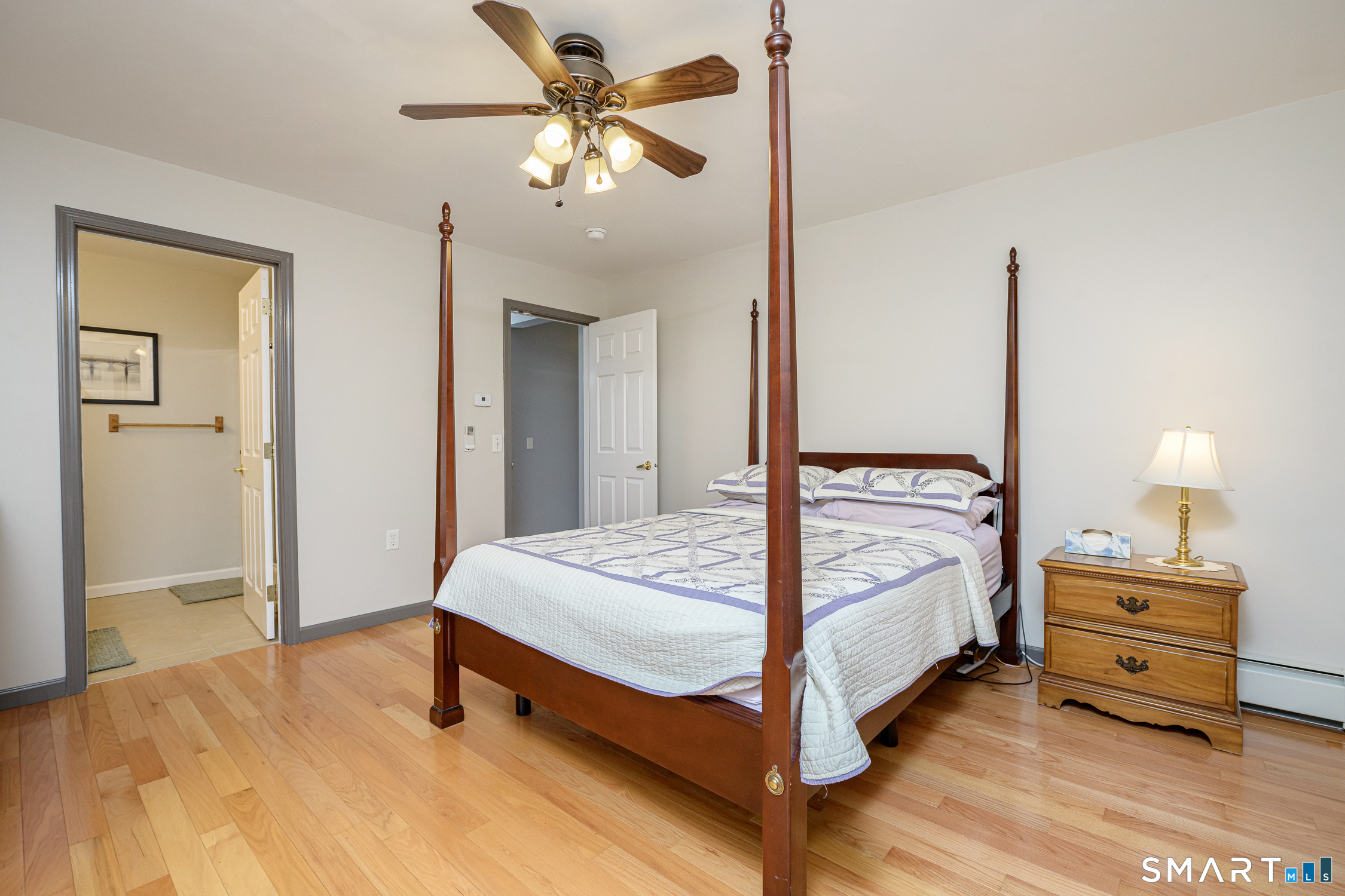 3 Oriole Drive, Unit 3 Killingly, CT 06239 - Photo 15 of 29 a bedroom with a bed and a chandelier