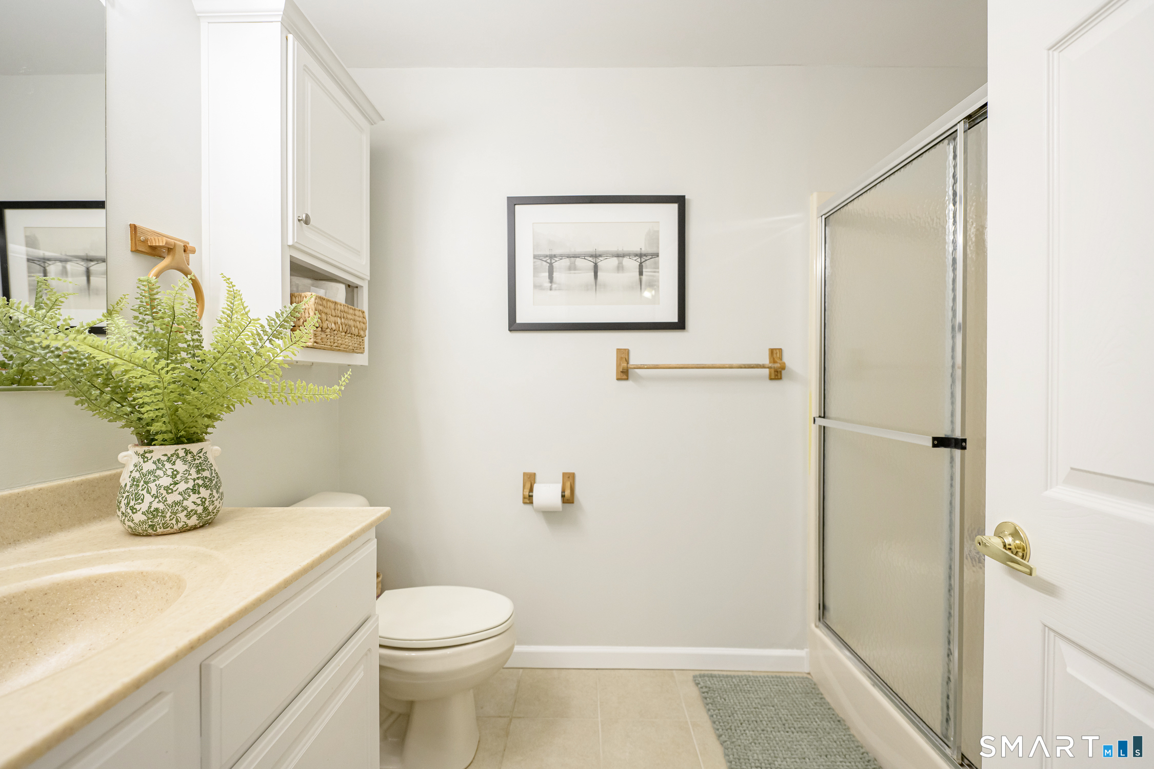 3 Oriole Drive, Unit 3 Killingly, CT 06239 - Photo 16 of 29 a bathroom with a sink mirror vanity and toilet