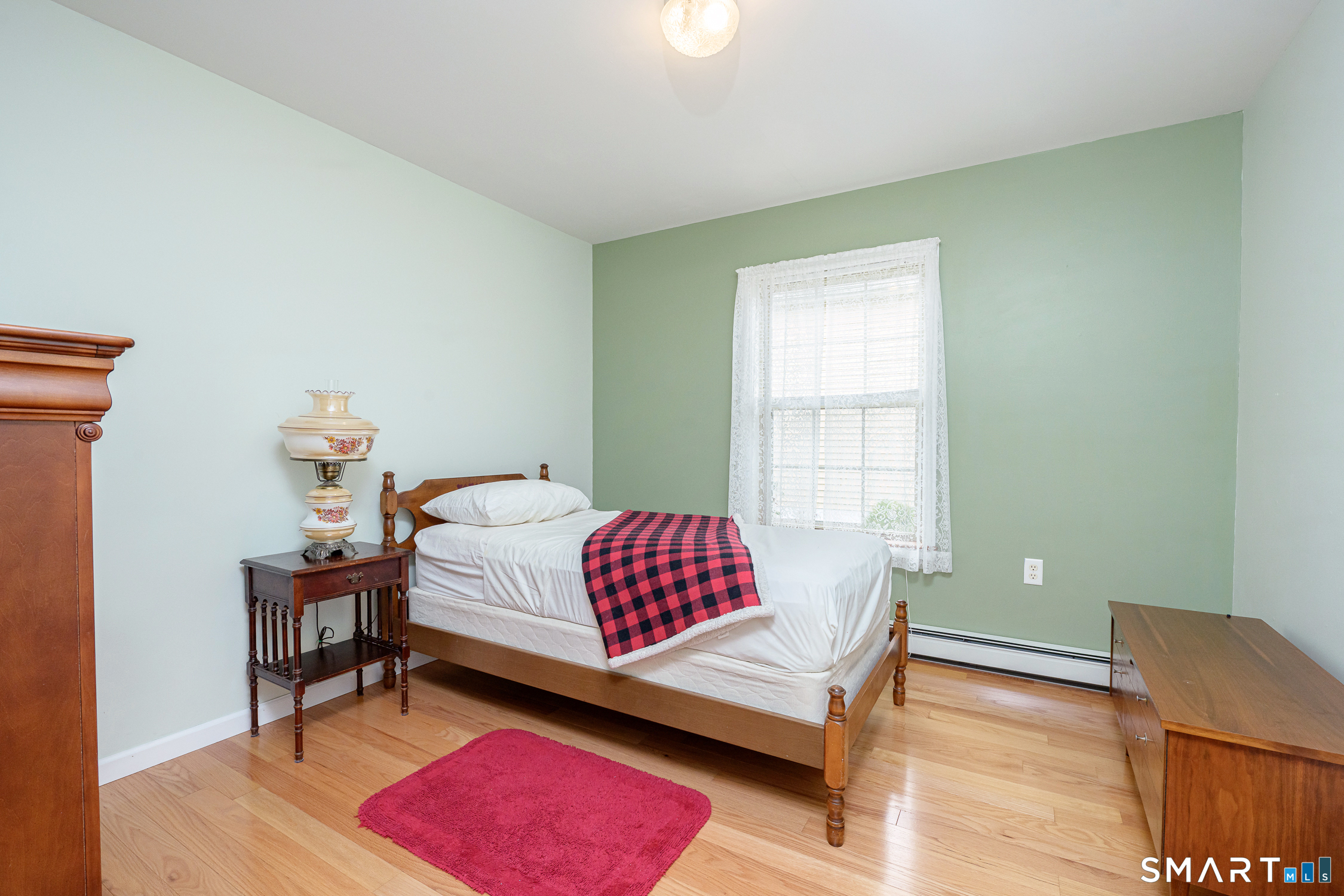 3 Oriole Drive, Unit 3 Killingly, CT 06239 - Photo 18 of 29 a bedroom with a bed and a window