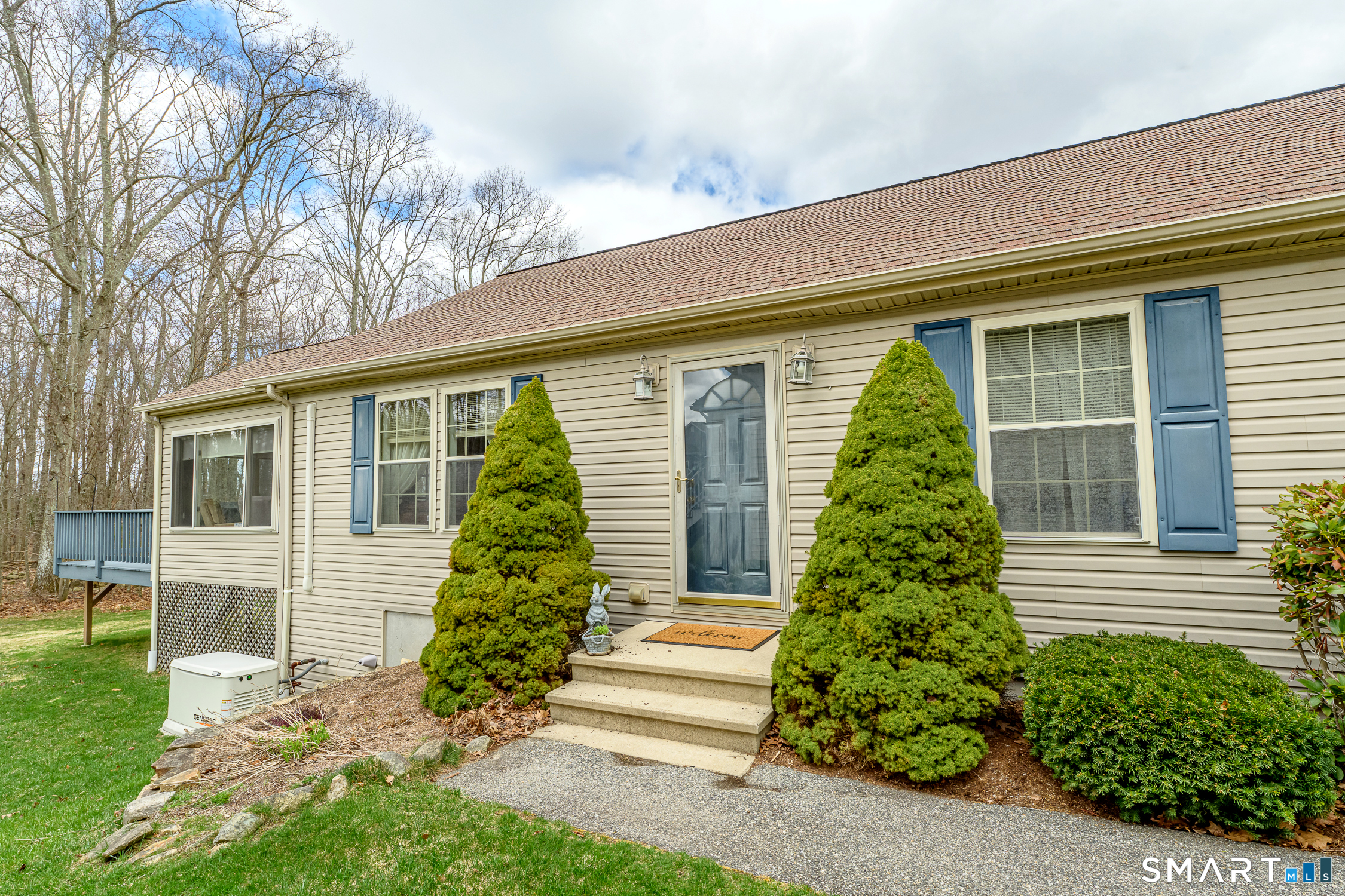 3 Oriole Drive, Unit 3 Killingly, CT 06239 - Photo 2 of 29 a front view of a house with a yard