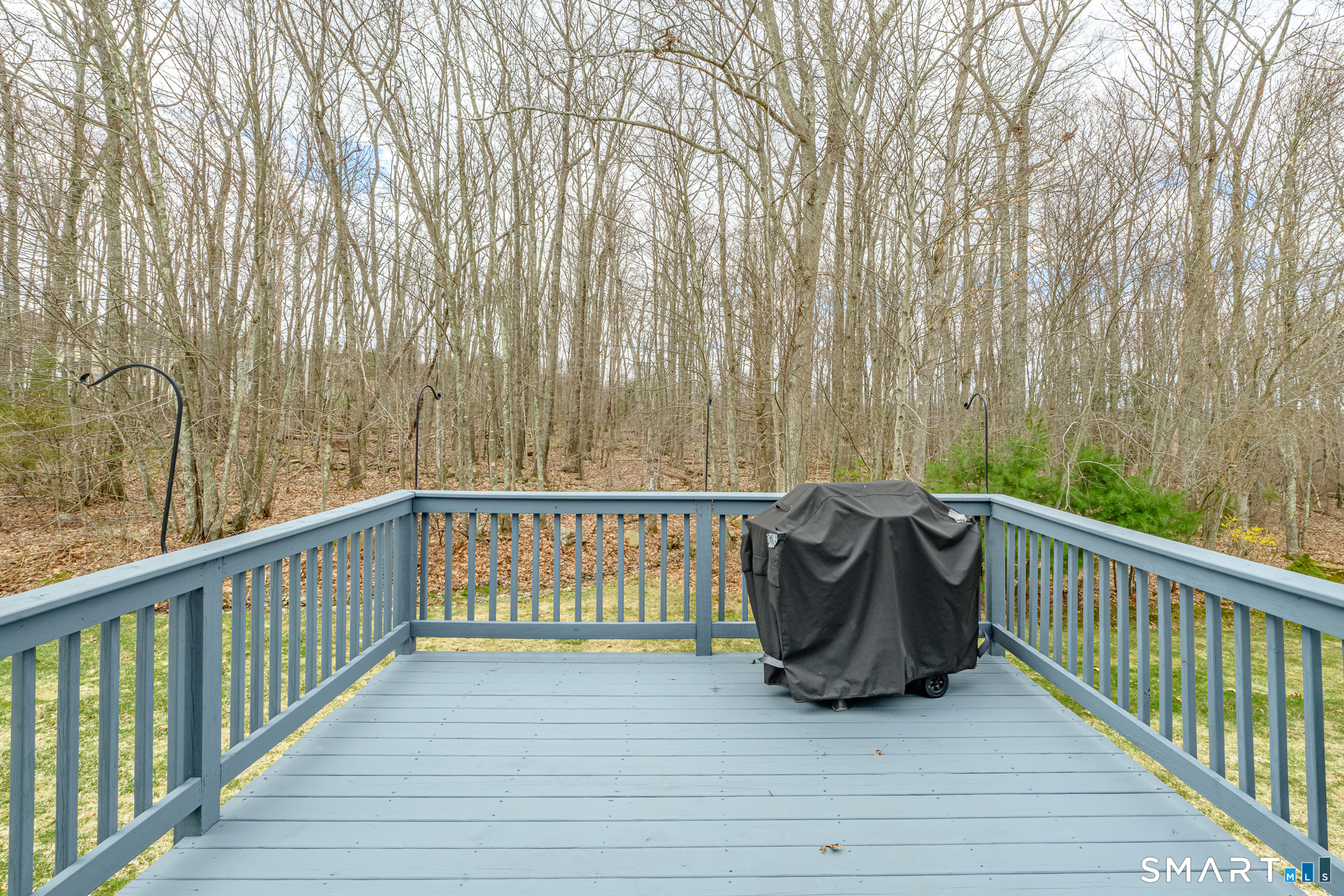 3 Oriole Drive, Unit 3 Killingly, CT 06239 - Photo 24 of 29 a view of a balcony with wooden floor