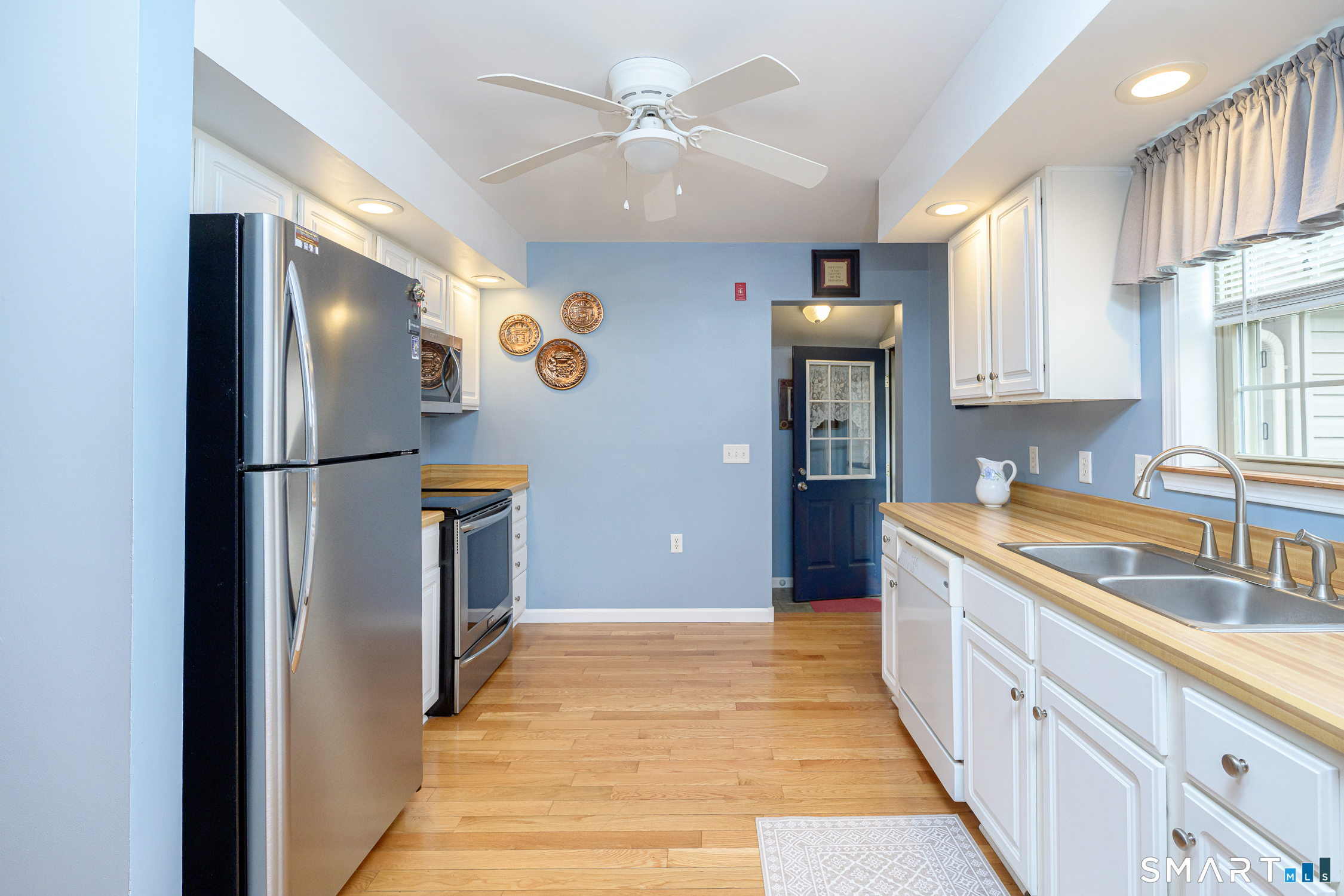 3 Oriole Drive, Unit 3 Killingly, CT 06239 - Photo 3 of 29 a kitchen with stainless steel appliances granite countertop a refrigerator and a sink