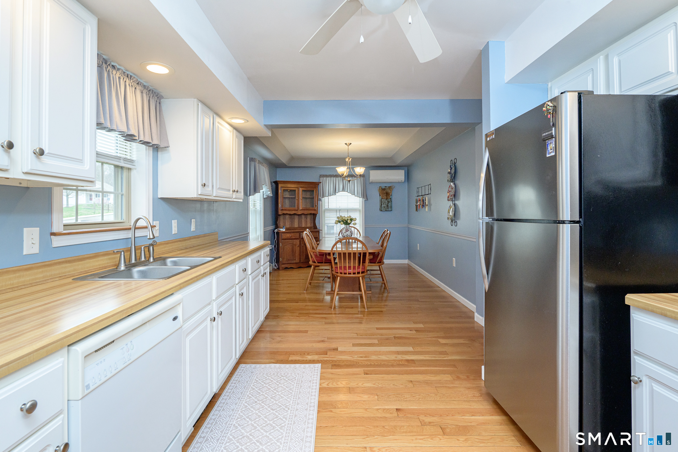 3 Oriole Drive, Unit 3 Killingly, CT 06239 - Photo 5 of 29 a kitchen with stainless steel appliances granite countertop a refrigerator and a sink