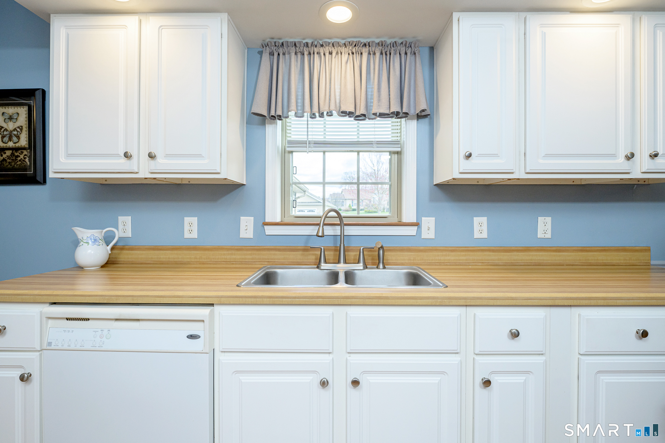 3 Oriole Drive, Unit 3 Killingly, CT 06239 - Photo 6 of 29 a kitchen with granite countertop white cabinets and a sink