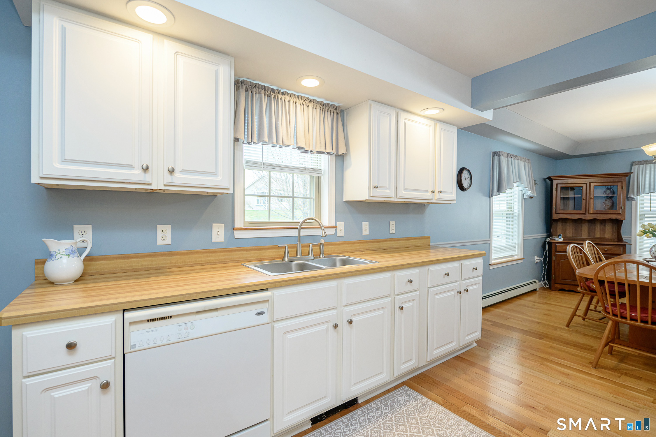 3 Oriole Drive, Unit 3 Killingly, CT 06239 - Photo 9 of 29 a kitchen with stainless steel appliances granite countertop a sink and cabinets