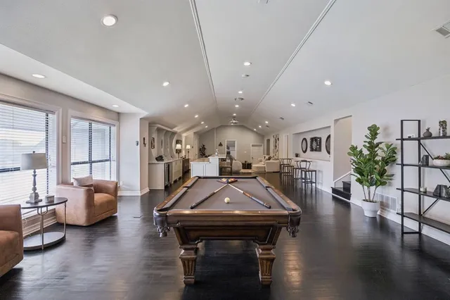 a view of living room with furniture and wooden floor