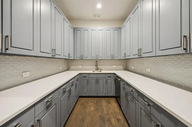 a kitchen with sink cabinets and window