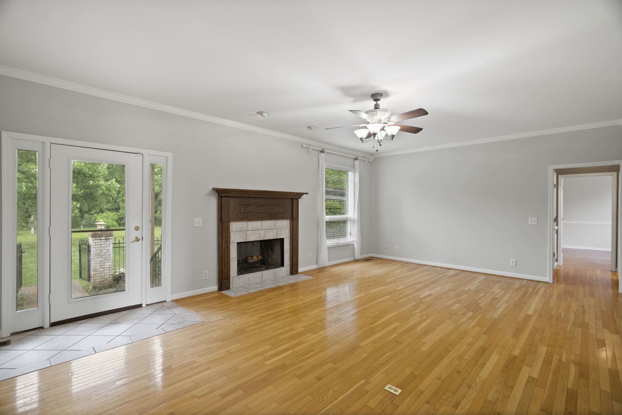 7144 Bidwell Road Joelton, TN 37080 - Photo 13 of 60 a view of an empty room with a fireplace and a window