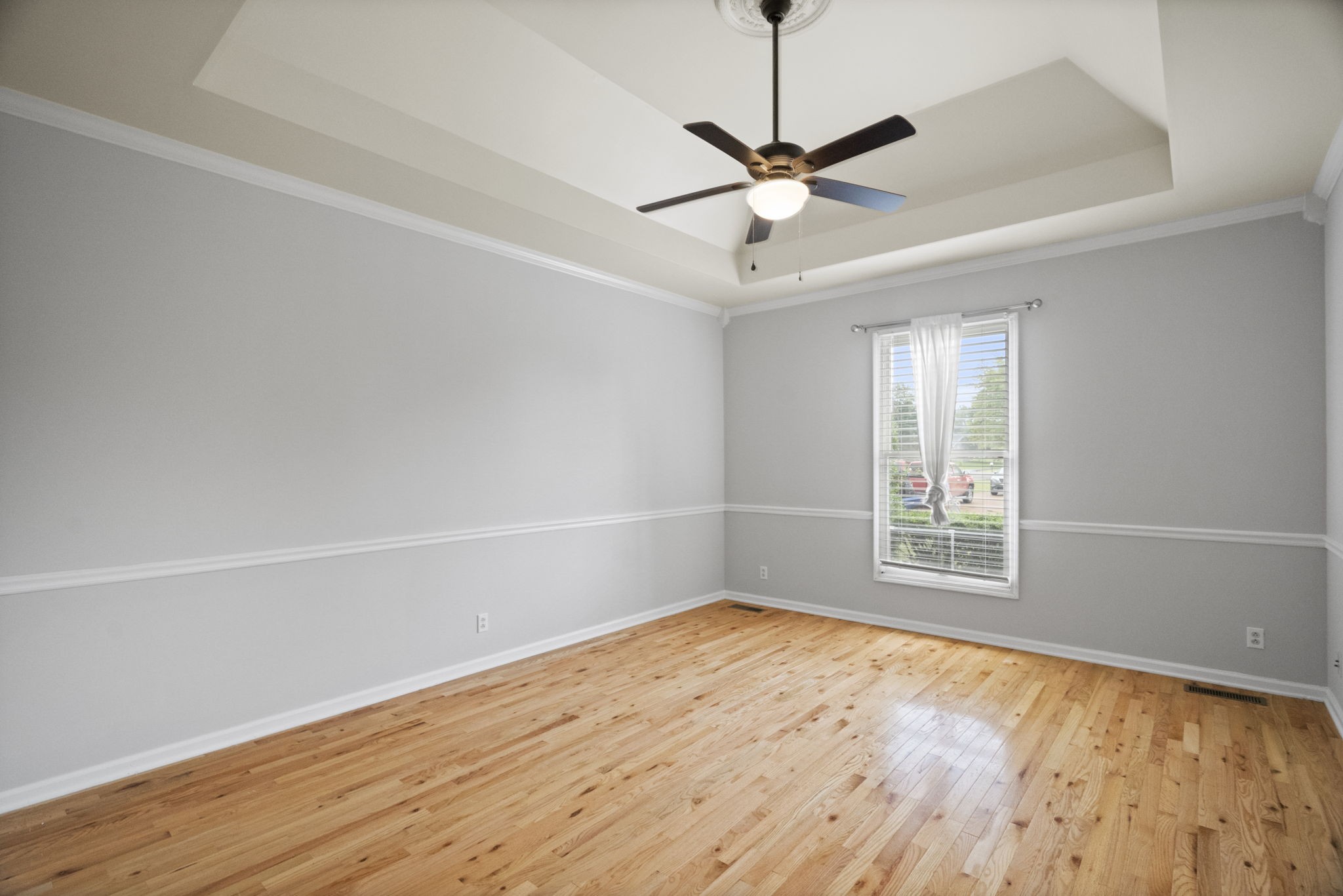 7144 Bidwell Road Joelton, TN 37080 - Photo 19 of 60 an empty room with wooden floor fan and windows