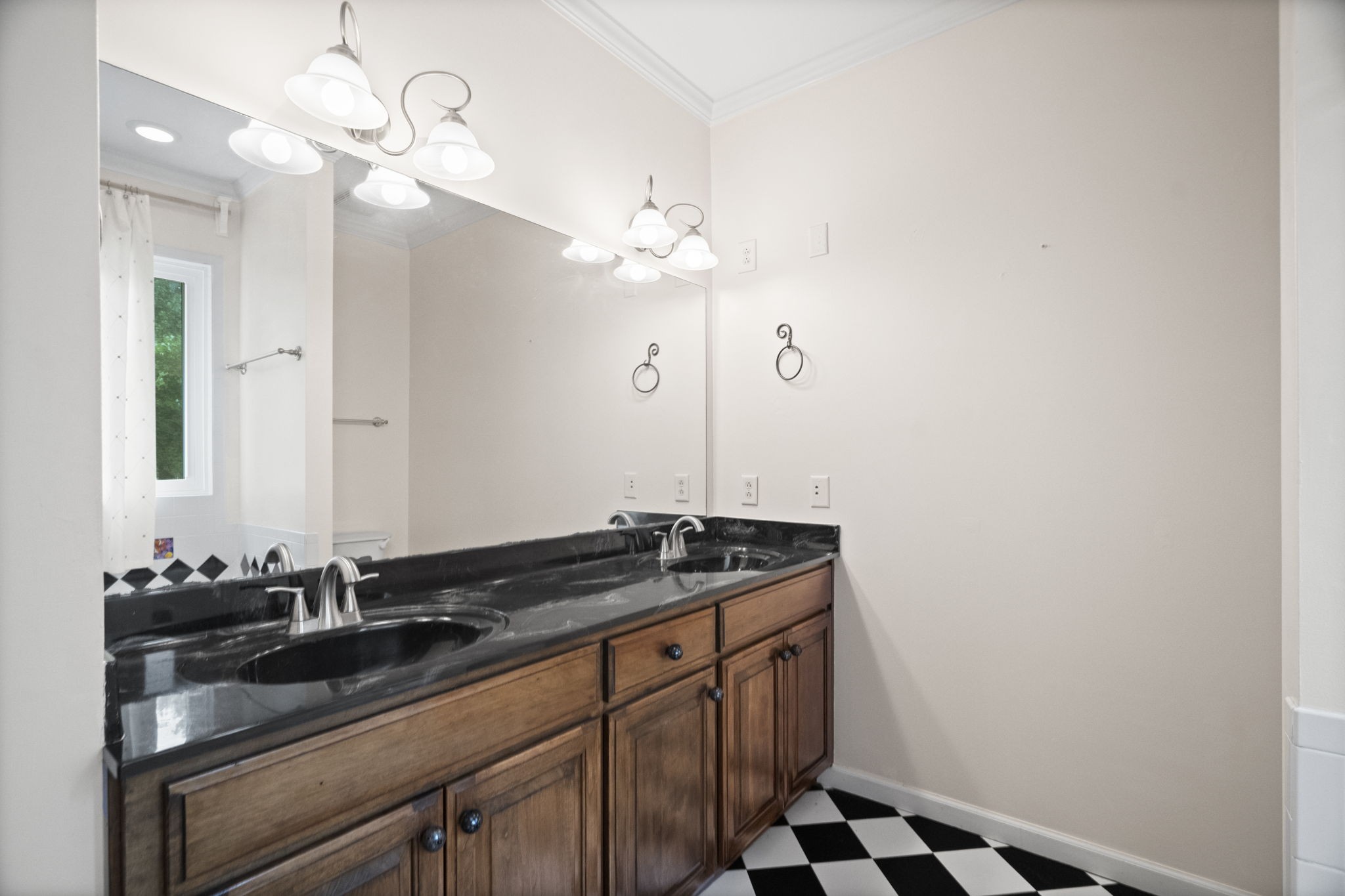 7144 Bidwell Road Joelton, TN 37080 - Photo 26 of 60 a bathroom with a sink and a mirror