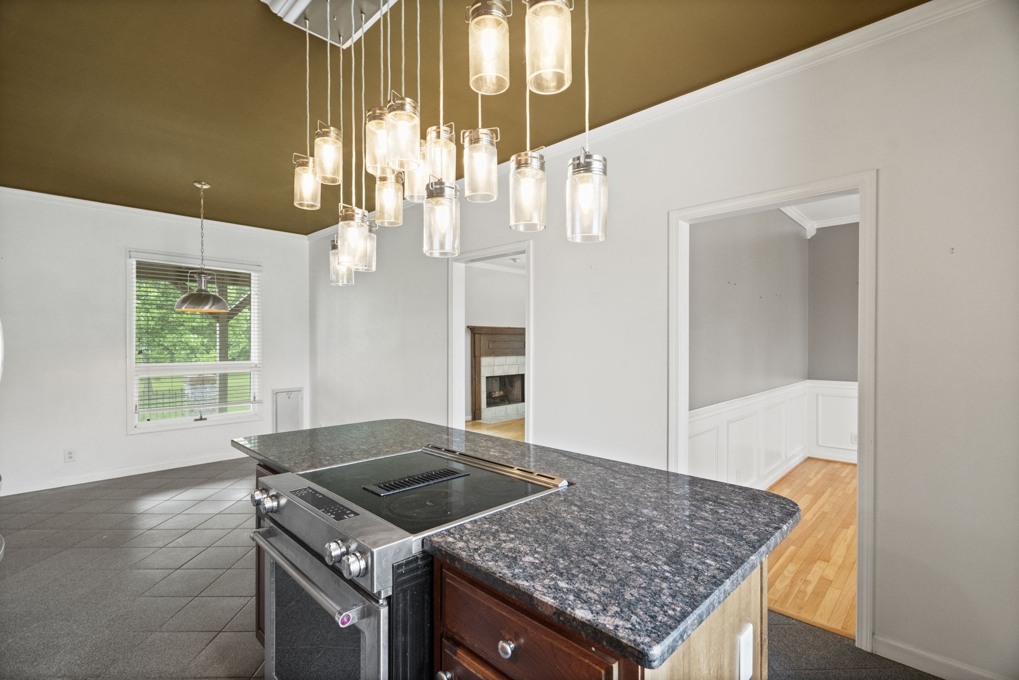 7144 Bidwell Road Joelton, TN 37080 - Photo 30 of 60 a kitchen with a stove and a wooden floor