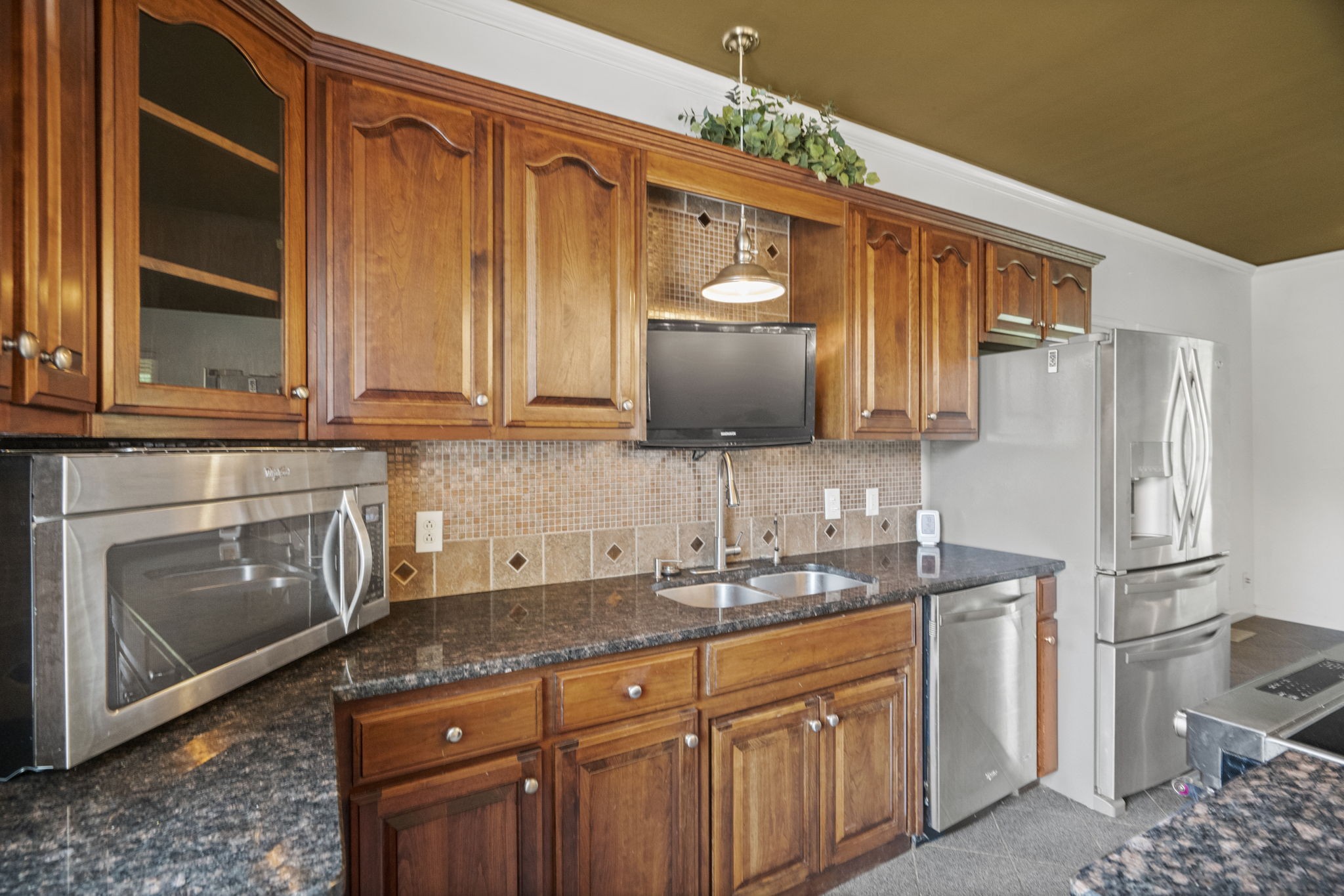 7144 Bidwell Road Joelton, TN 37080 - Photo 33 of 60 a kitchen with stainless steel appliances granite countertop a refrigerator stove and sink