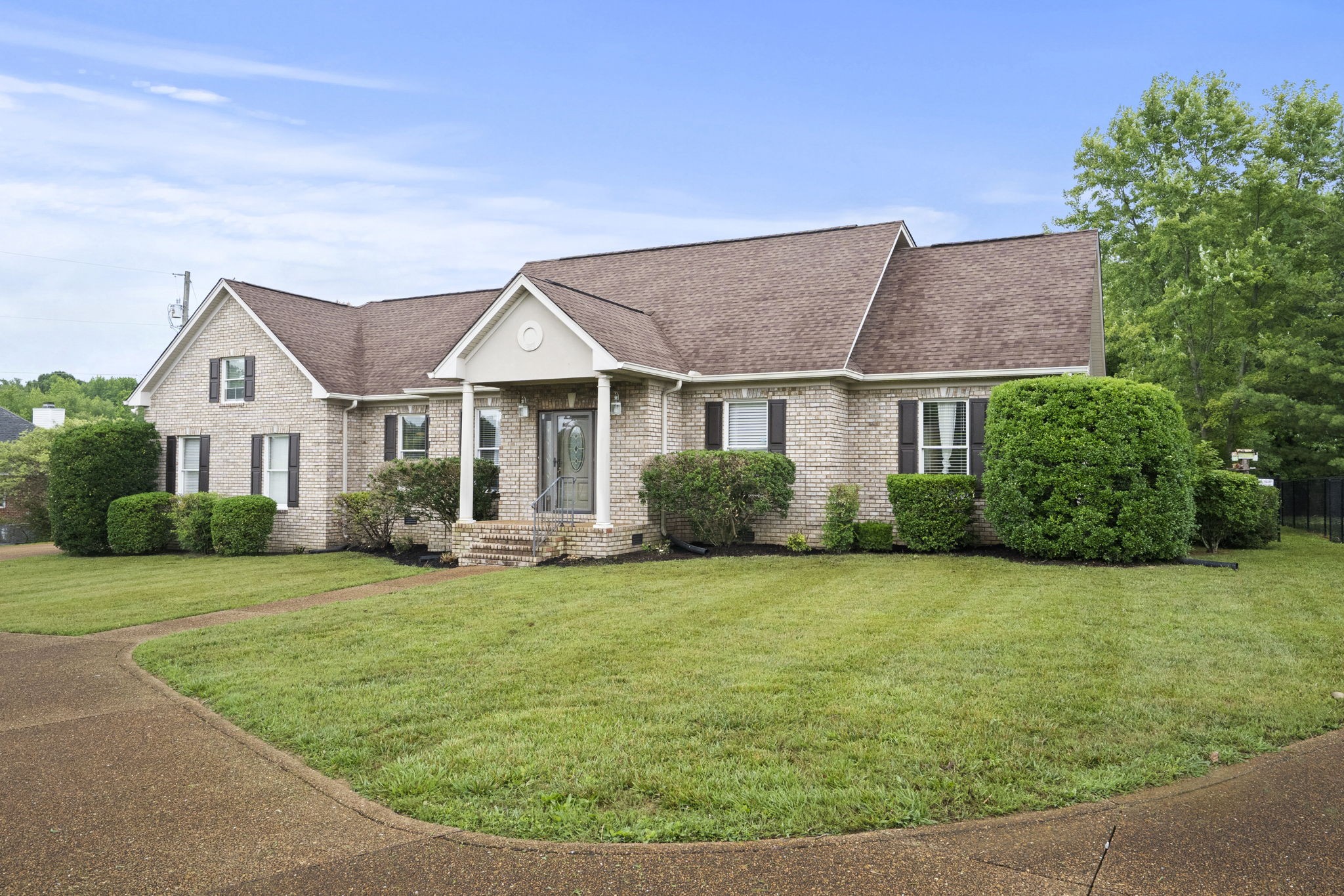 7144 Bidwell Road Joelton, TN 37080 - Photo 7 of 60 a front view of a house with a garden