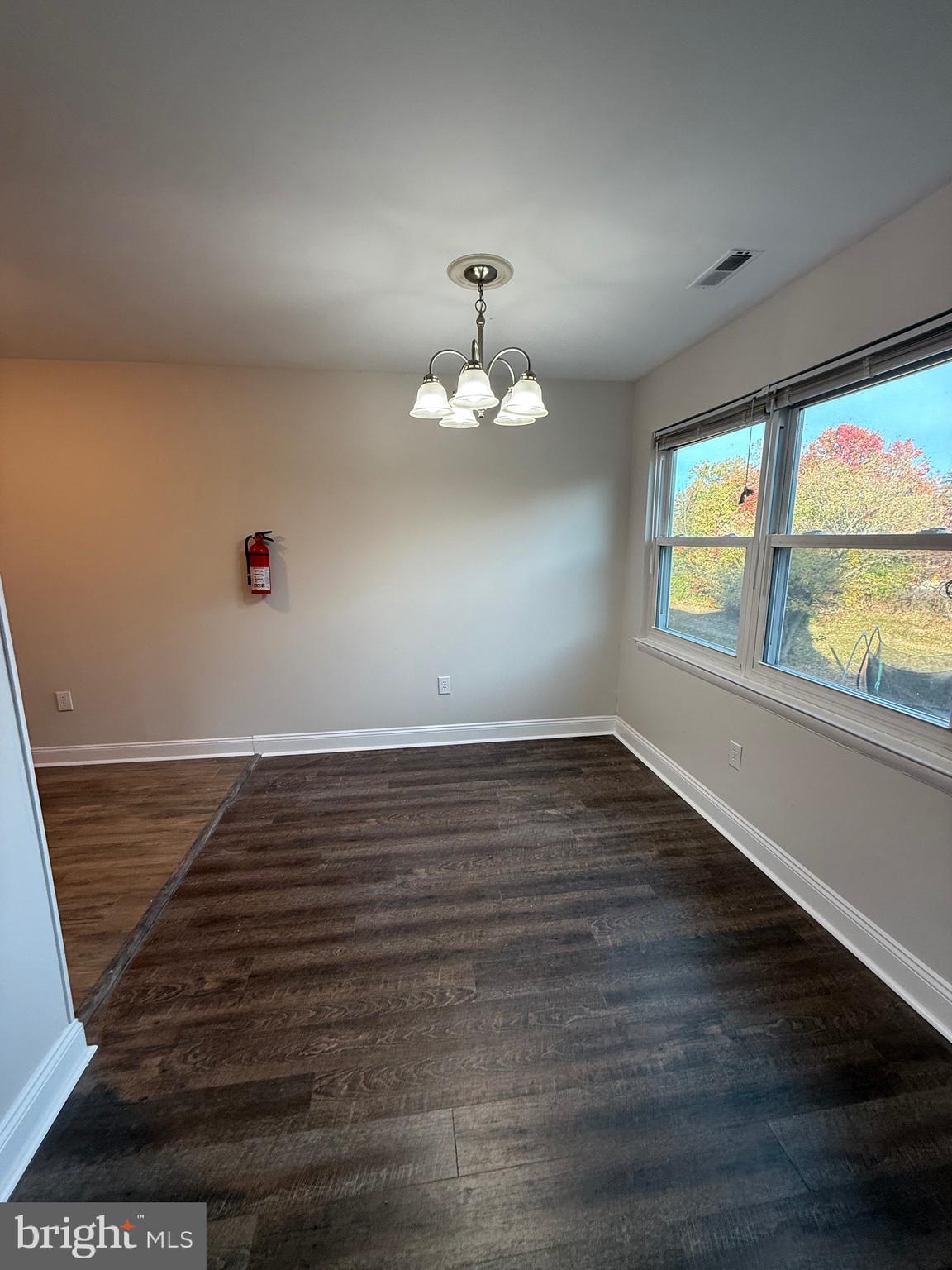 162 Willow Turn, Unit B Mount Laurel, NJ 08054 - Photo 3 of 12 wooden floor in an empty room with a window
