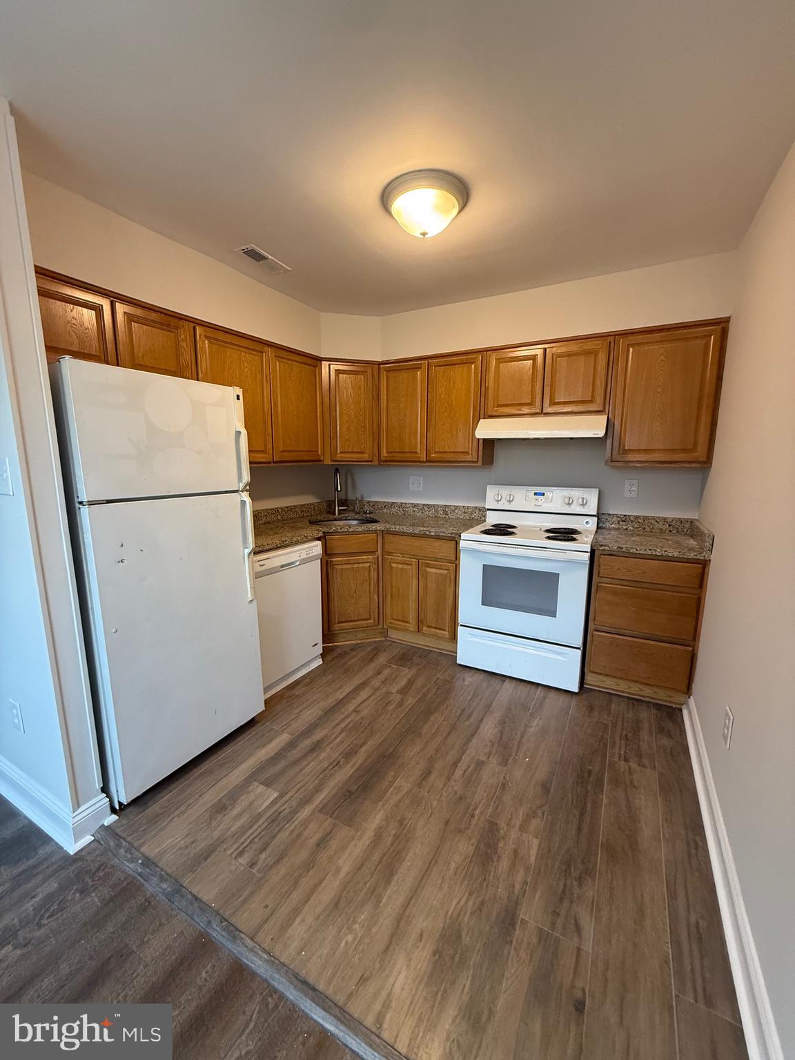 162 Willow Turn, Unit B Mount Laurel, NJ 08054 - Photo 4 of 12 a kitchen with wooden floors and appliances