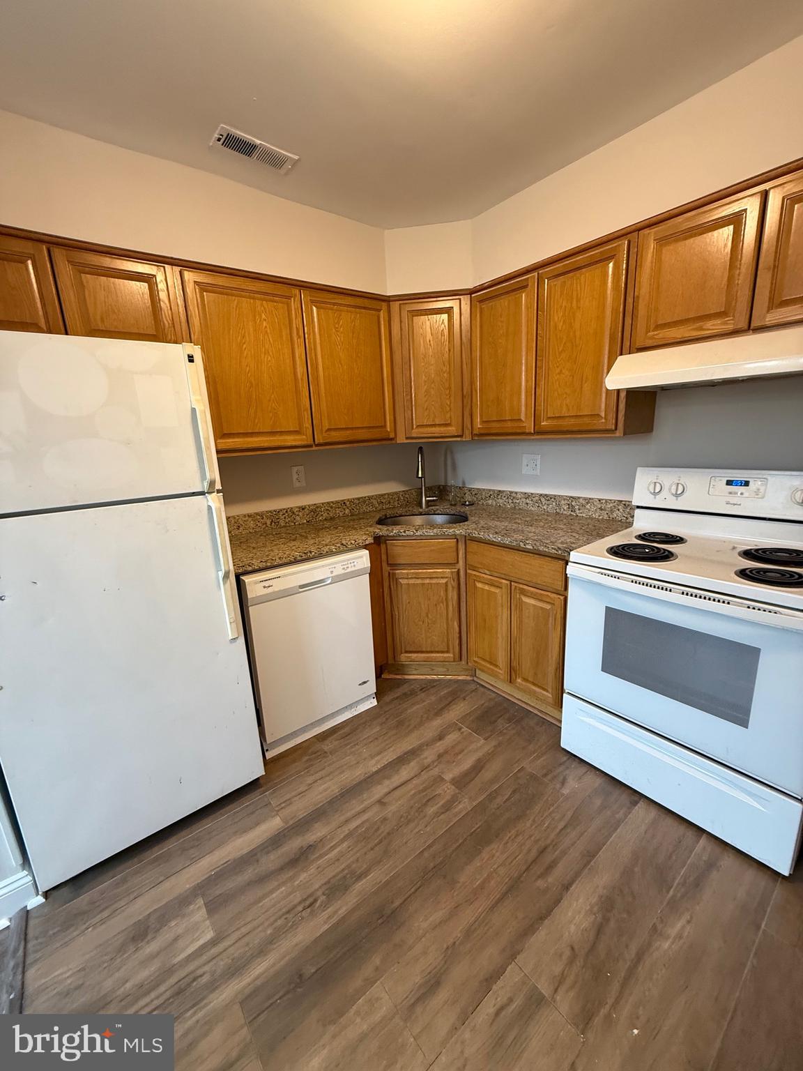 162 Willow Turn, Unit B Mount Laurel, NJ 08054 - Photo 5 of 12 a kitchen with a sink a stove and a refrigerator