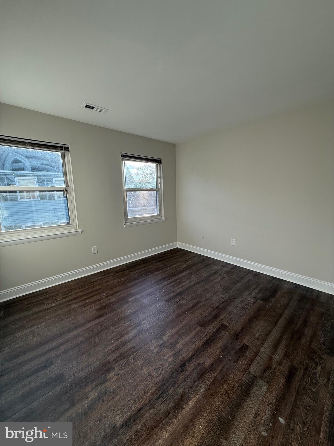 162 Willow Turn, Unit B Mount Laurel, NJ 08054 - Photo 9 of 12 a view of an empty room with wooden floor and a window