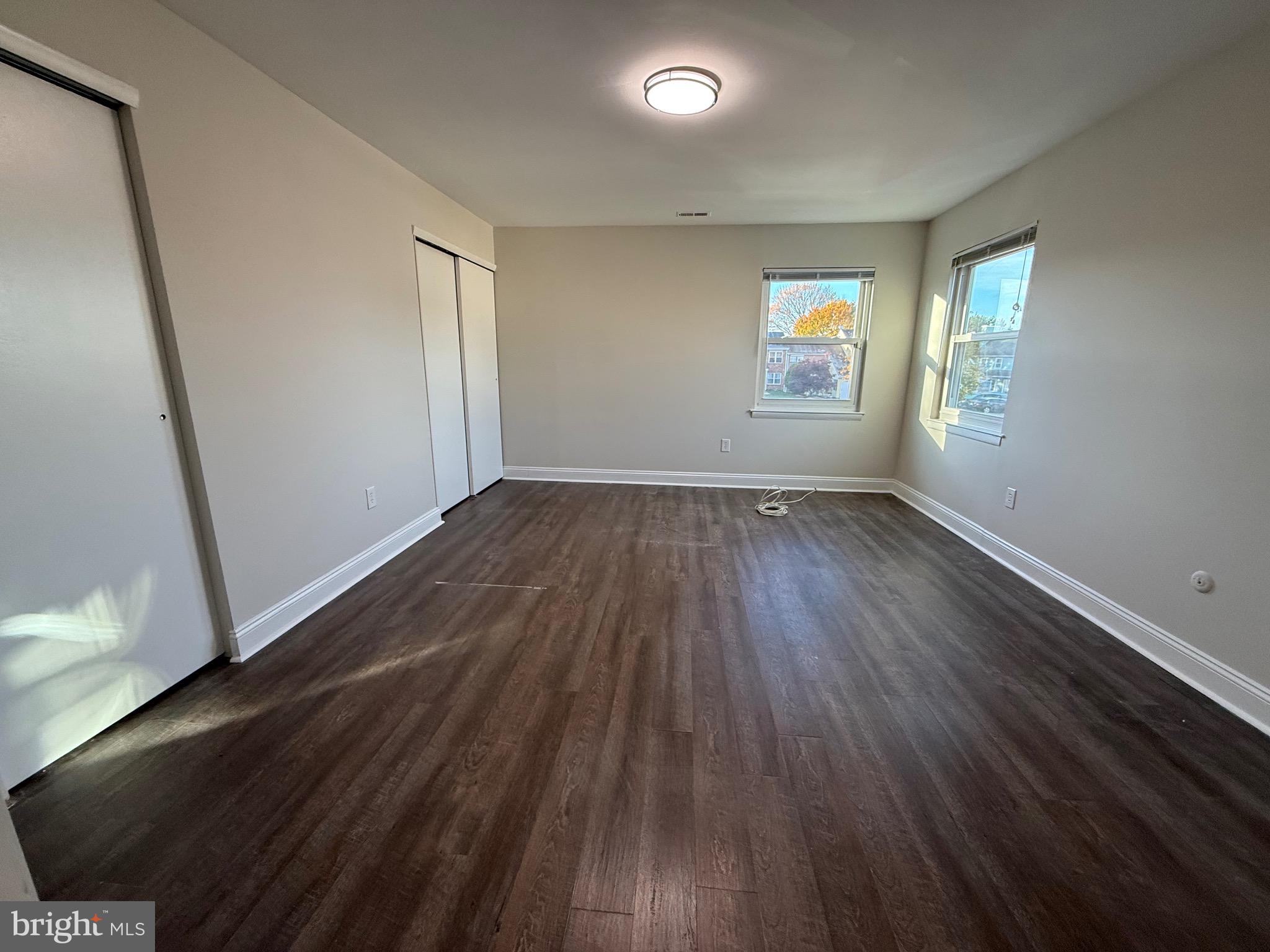162 Willow Turn, Unit B Mount Laurel, NJ 08054 - Photo 10 of 12 wooden floor in an empty room with a window