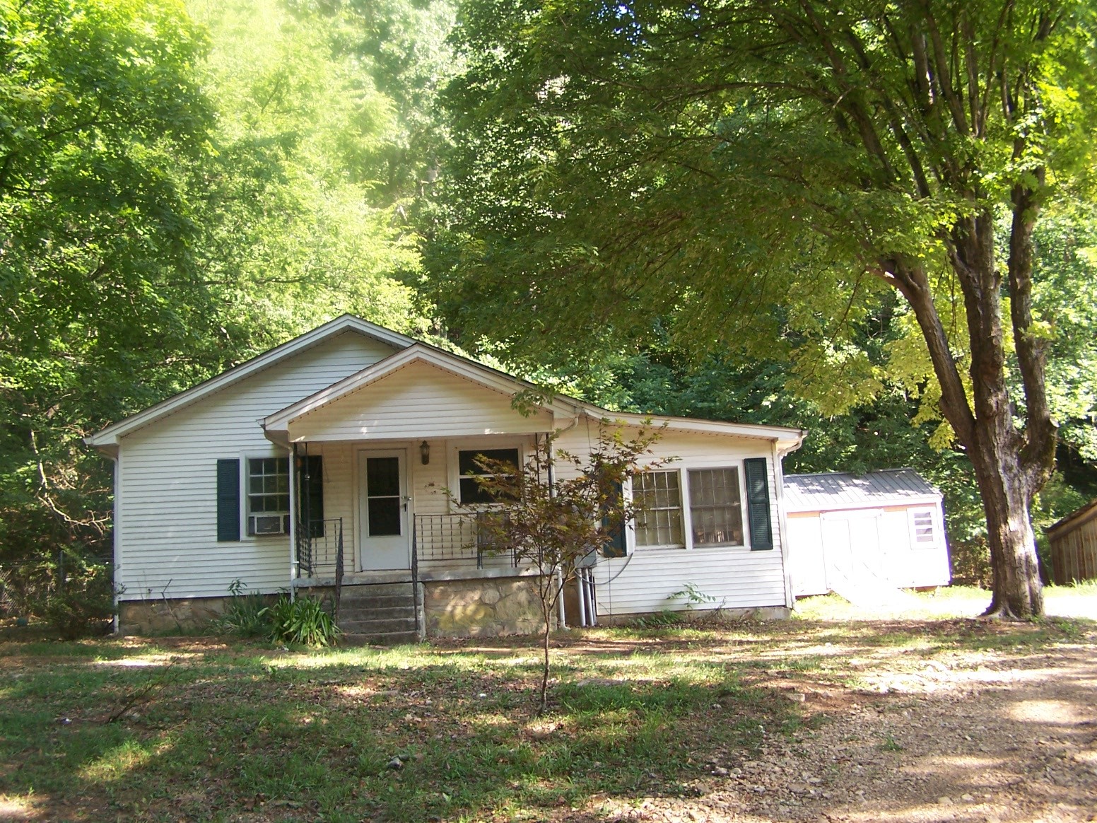 1346 Garner Hollow Road Pulaski, TN 38478 - Photo 12 of 42 a front view of a house with a yard