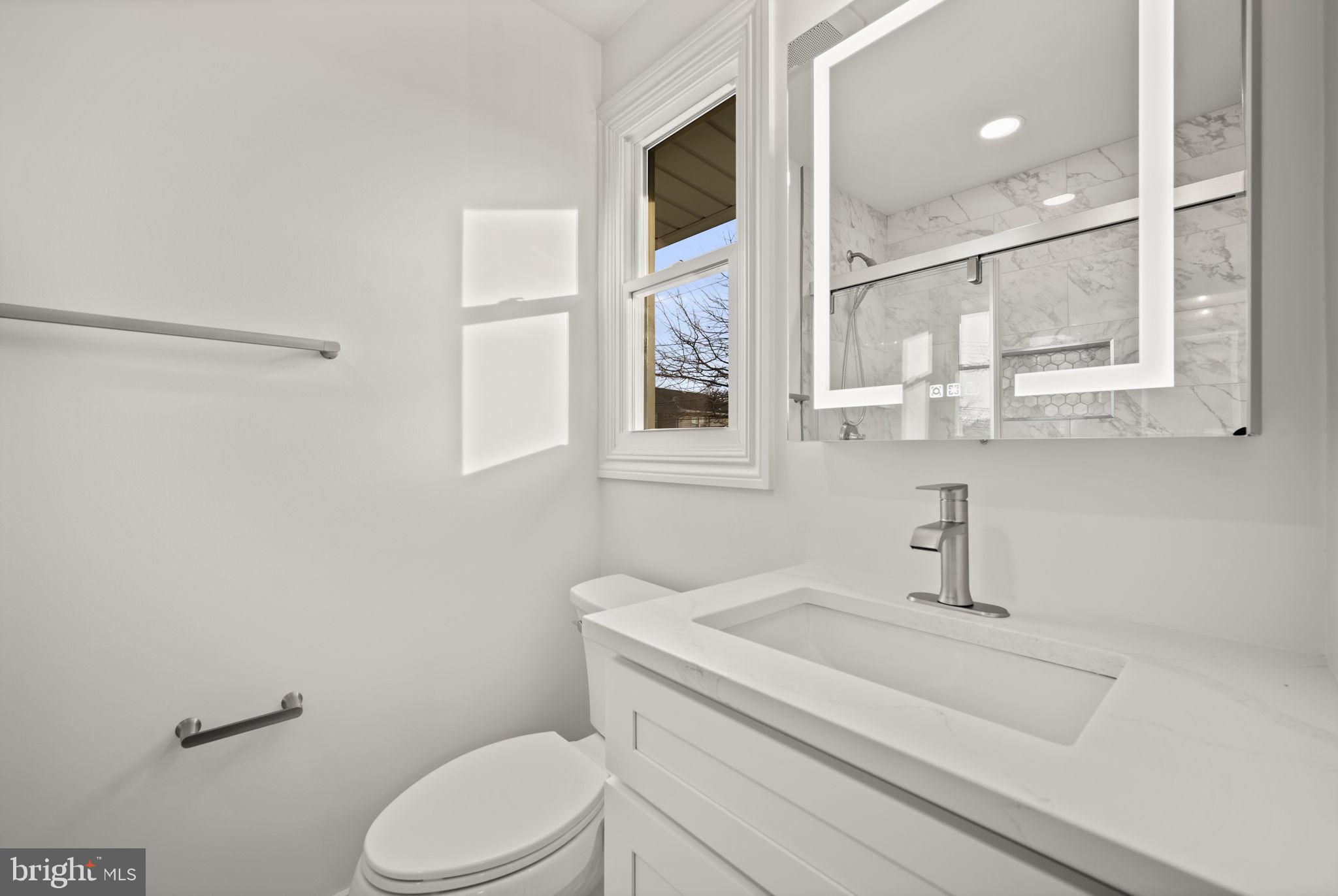 2111 Eastridge Road Lutherville-Timonium, MD 21093 - Photo 20 of 44 a bathroom with a sink toilet and shower
