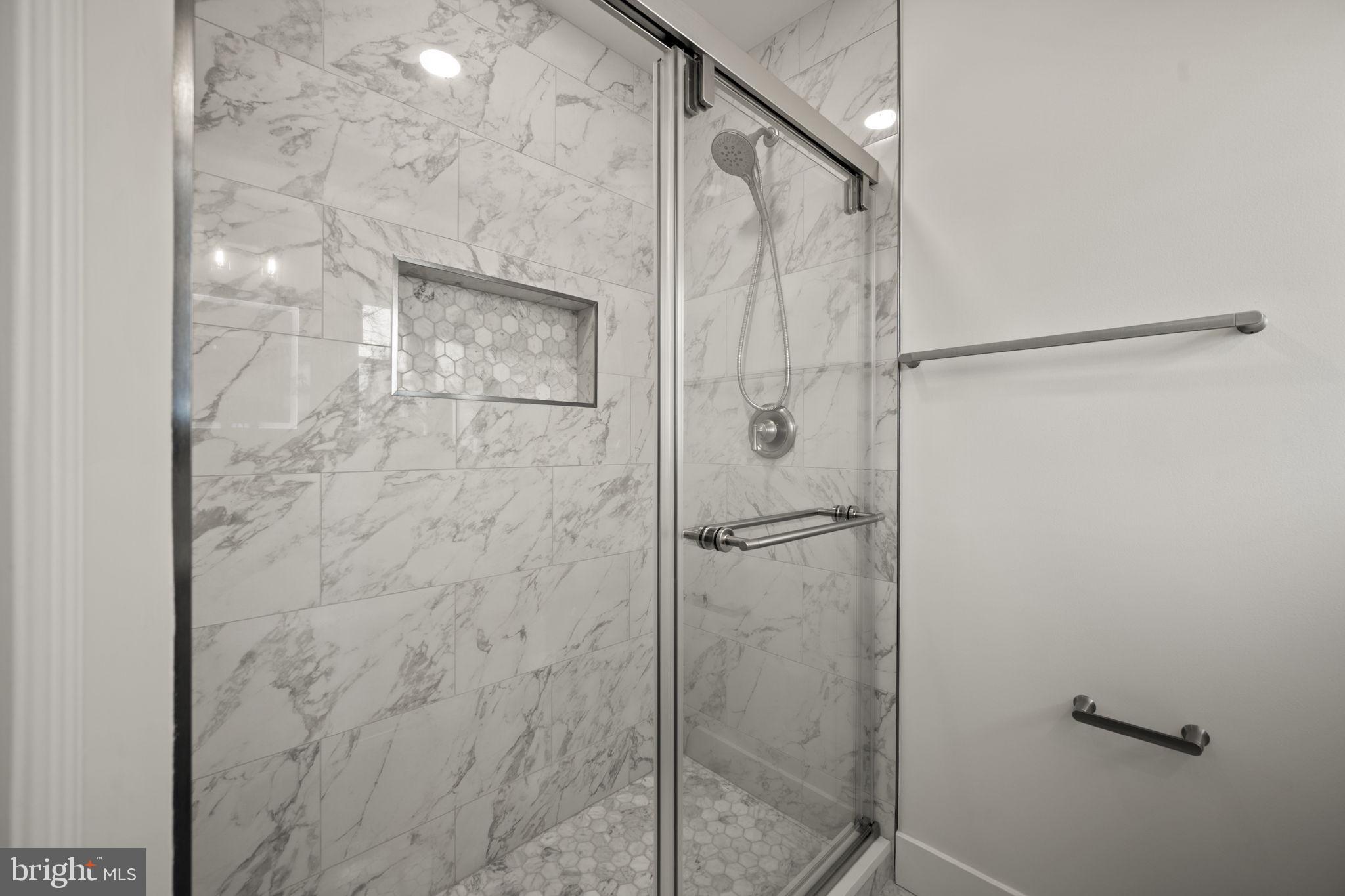 2111 Eastridge Road Lutherville-Timonium, MD 21093 - Photo 21 of 44 a bathroom with a glass shower door