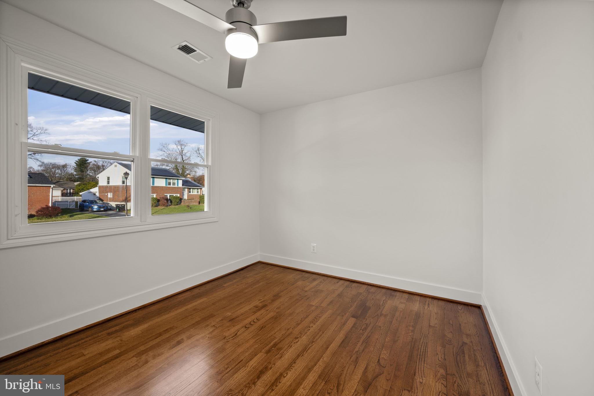 2111 Eastridge Road Lutherville-Timonium, MD 21093 - Photo 22 of 44 wooden floor in an empty room with a window