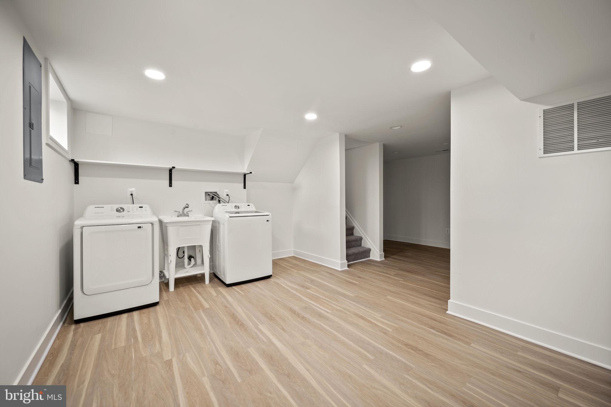 2111 Eastridge Road Lutherville-Timonium, MD 21093 - Photo 29 of 44 a view of a room with washing machine with wooden floor