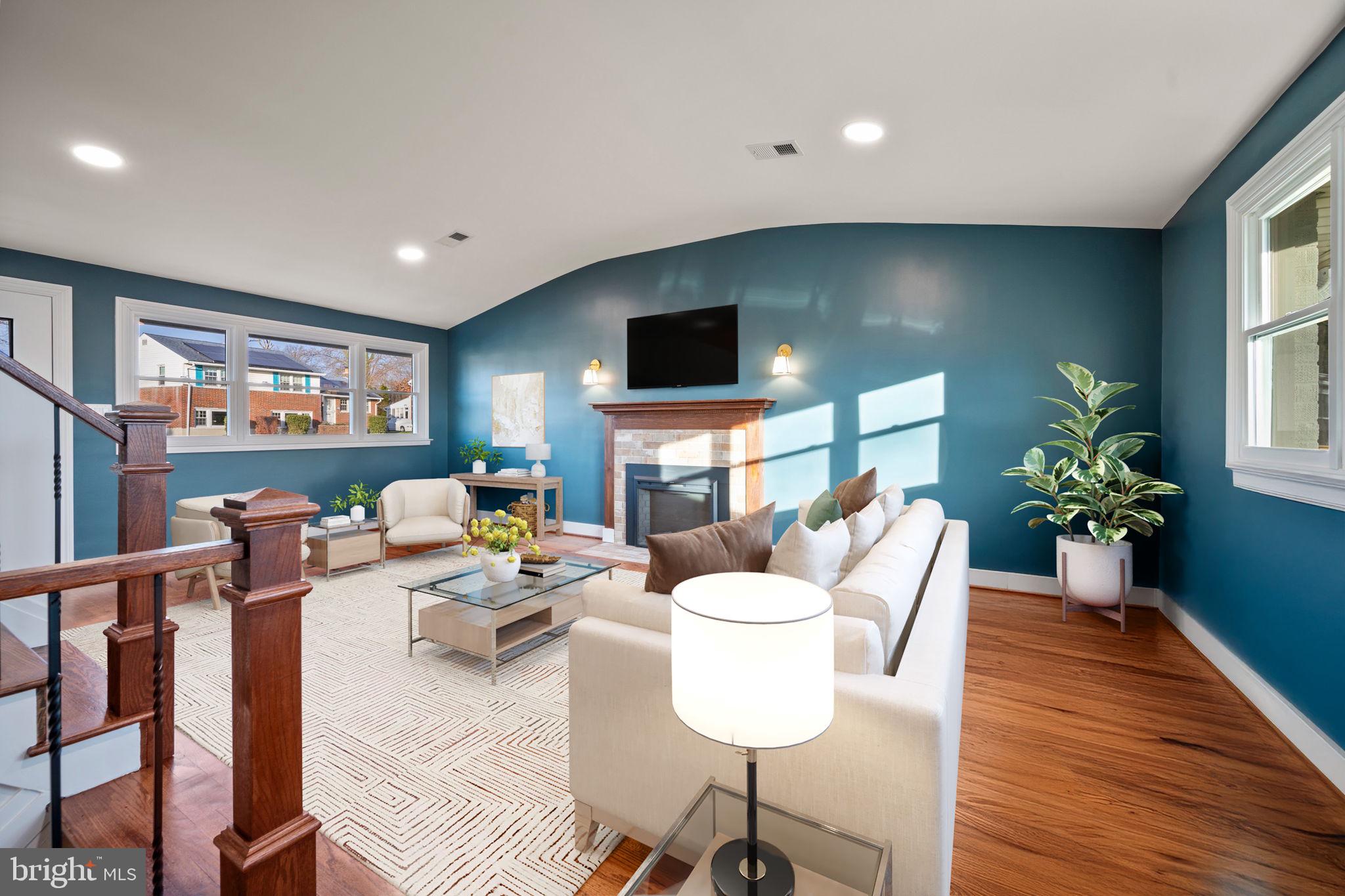 2111 Eastridge Road Lutherville-Timonium, MD 21093 - Photo 4 of 44 a living room with fireplace furniture and a flat screen tv