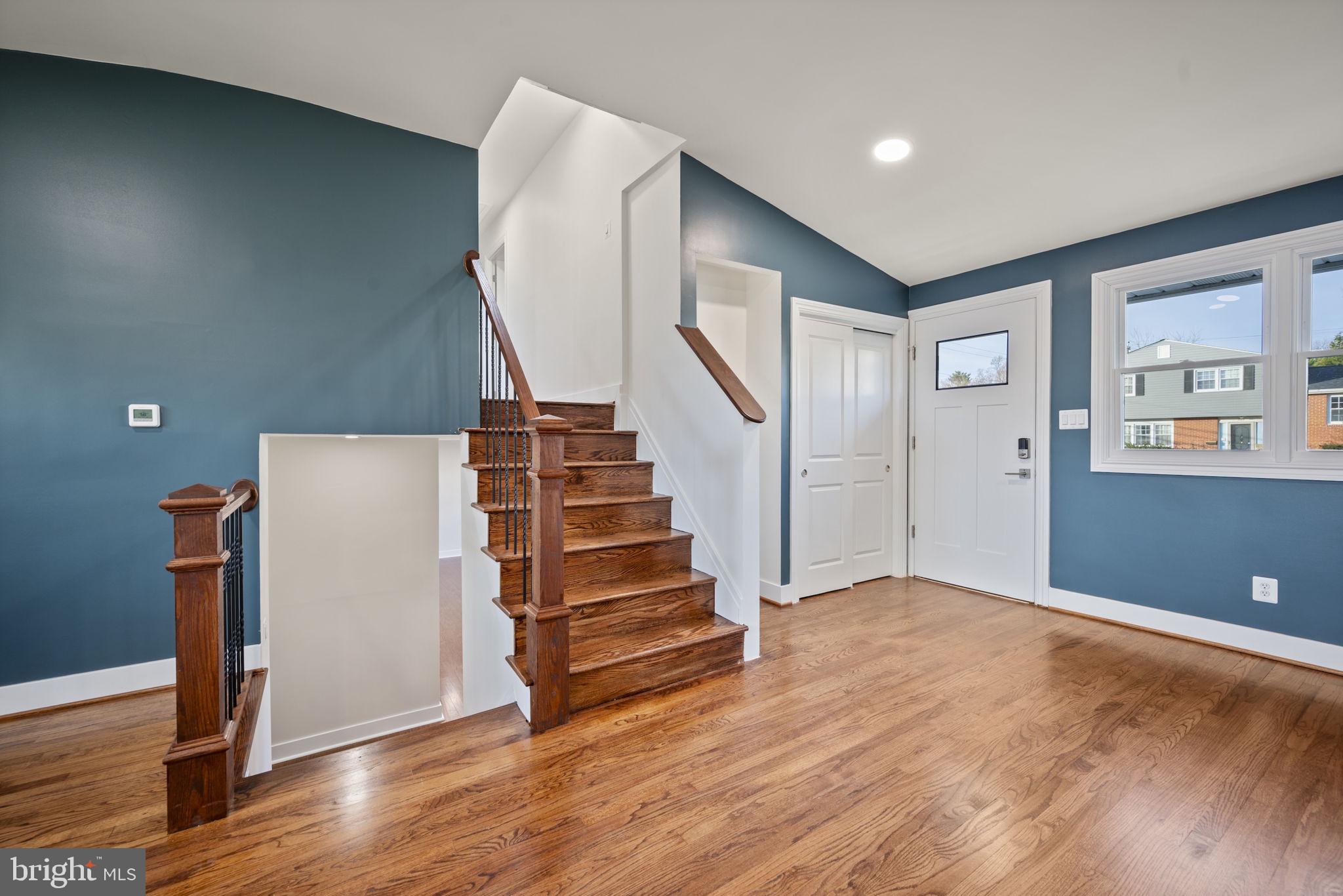 2111 Eastridge Road Lutherville-Timonium, MD 21093 - Photo 5 of 44 a view of a livingroom with wooden floor and stairs