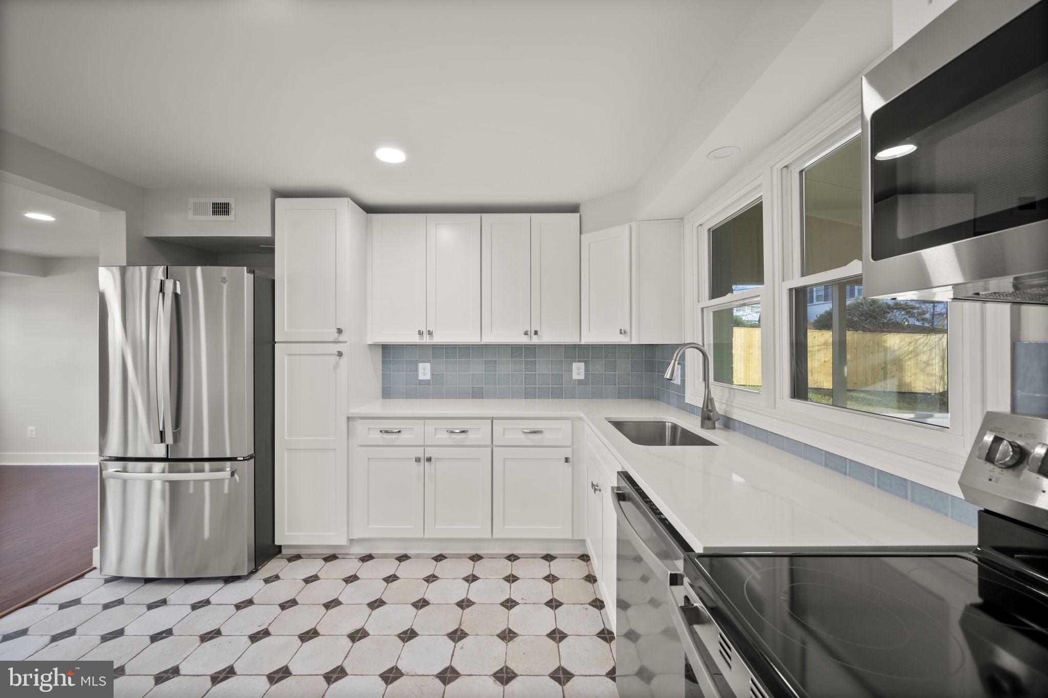 2111 Eastridge Road Lutherville-Timonium, MD 21093 - Photo 7 of 44 a kitchen with a sink appliances and cabinets