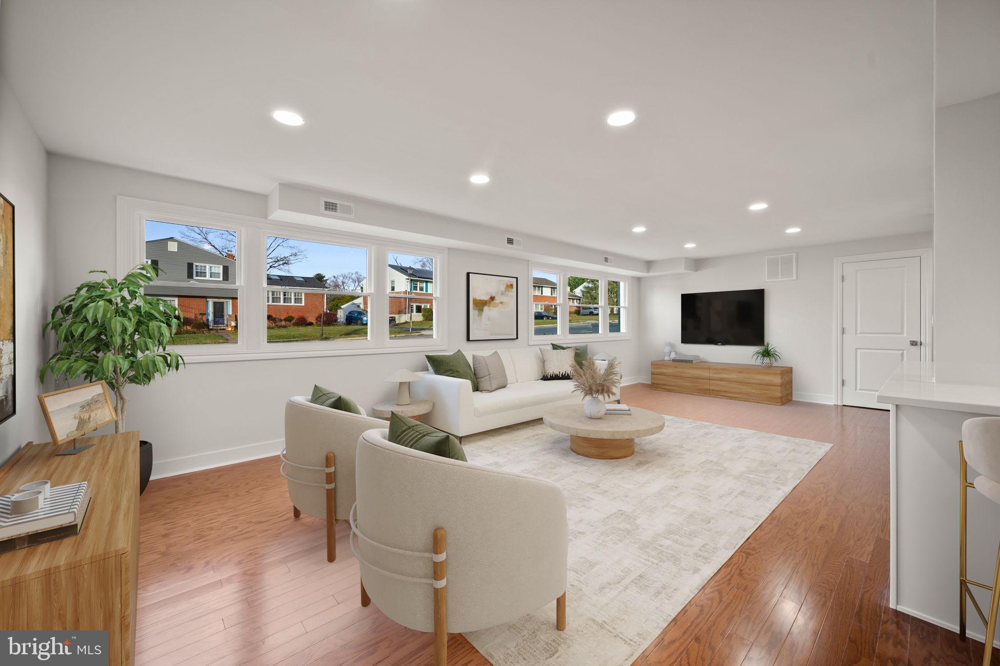 2111 Eastridge Road Lutherville-Timonium, MD 21093 - Photo 10 of 44 a living room with furniture and a flat screen tv