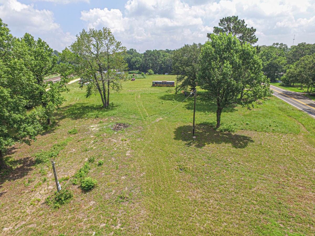 3503 State Highway Loop Livingston, TX 77351 - Photo 13 of 13 Aerial view from back of property. There is a grass covered pad for a mobile home there are 2-3 electric meter poles on property and 2 septic tanks ( must check for viability)