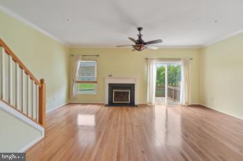 312 Blenny Lane Chester, MD 21619 - Photo 13 of 44 a view of an empty room with a fireplace and a window
