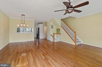 312 Blenny Lane Chester, MD 21619 - Photo 18 of 44 a view of an empty room with wooden floor and a ceiling fan