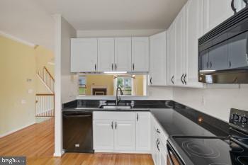 312 Blenny Lane Chester, MD 21619 - Photo 21 of 44 a kitchen with a sink a stove and cabinets