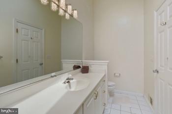 312 Blenny Lane Chester, MD 21619 - Photo 34 of 44 a bathroom with a sink and a mirror
