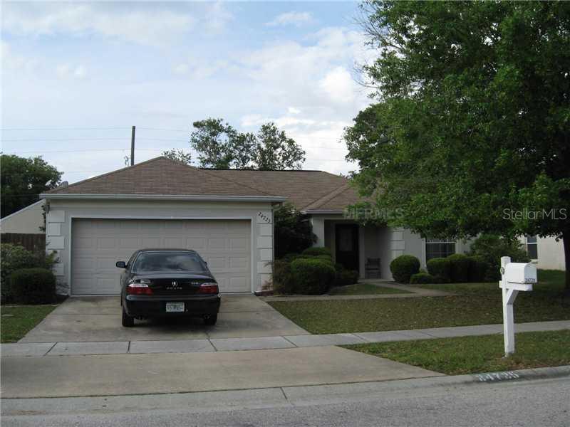 24725 Laurel Ridge Drive Lutz, FL 33559 - Photo 1 of 1 a car parked in front of a house