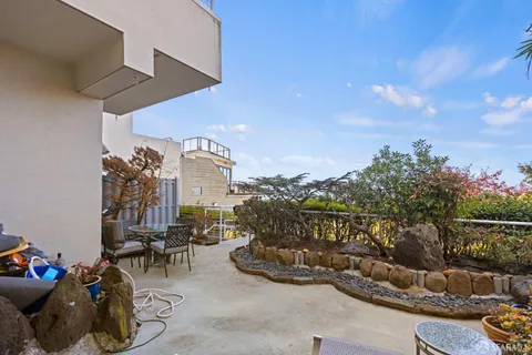 a view of a chairs and table in a patio