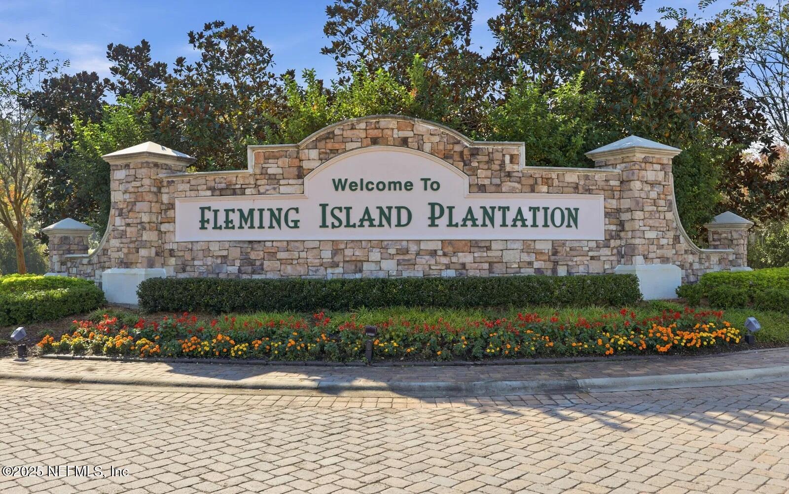 1500 Calming Water Drive, Unit 5703 Fleming Island, FL 32003 - Photo 1 of 17 a sign on the side of a building